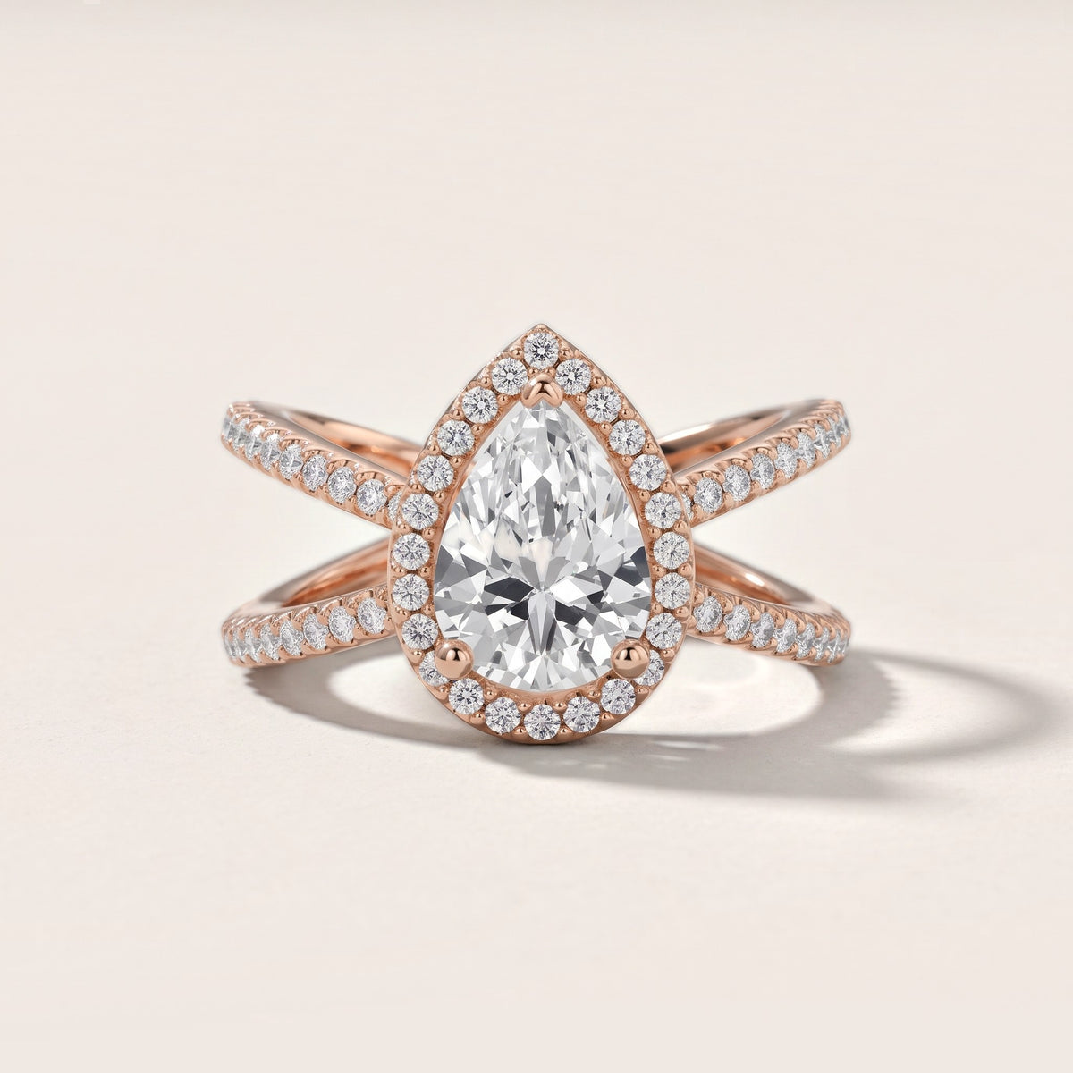 Sparks Crossover Halo Pear Diamond Engagement Ring in Rose Gold - front.jpg