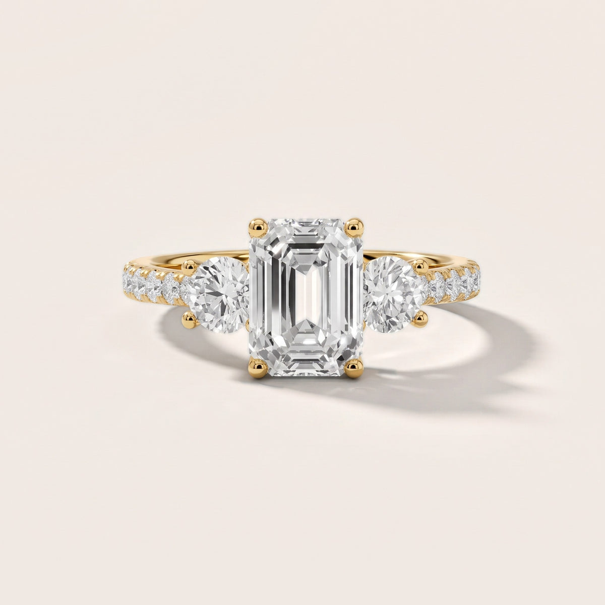 Sibyl Trellis Three-Stone Emerald Diamond Engagement Ring in Yellow Gold - front.jpg