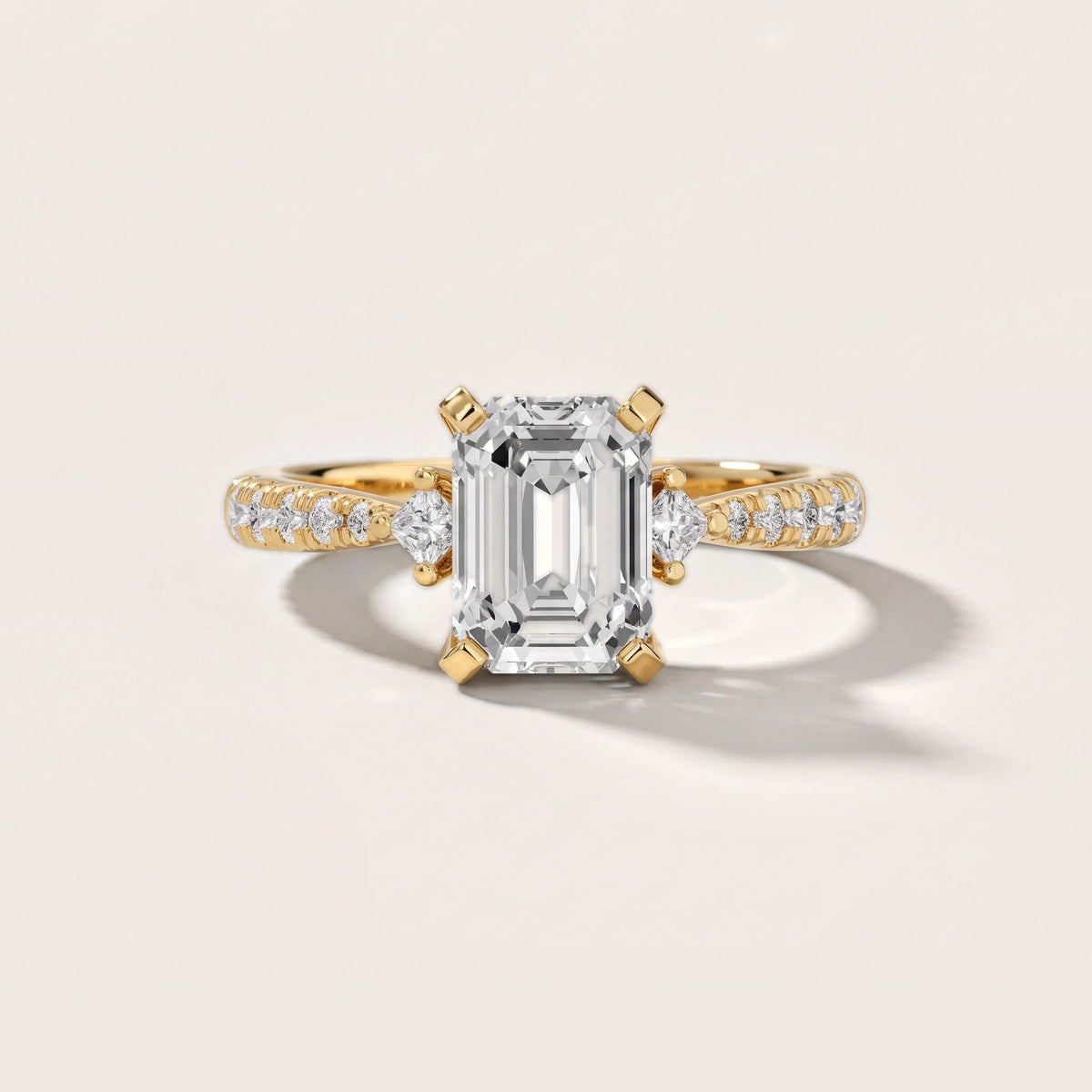 Alethea Three-Stone Pavé Emerald Diamond Engagement Ring in Yellow Gold - front.jpg