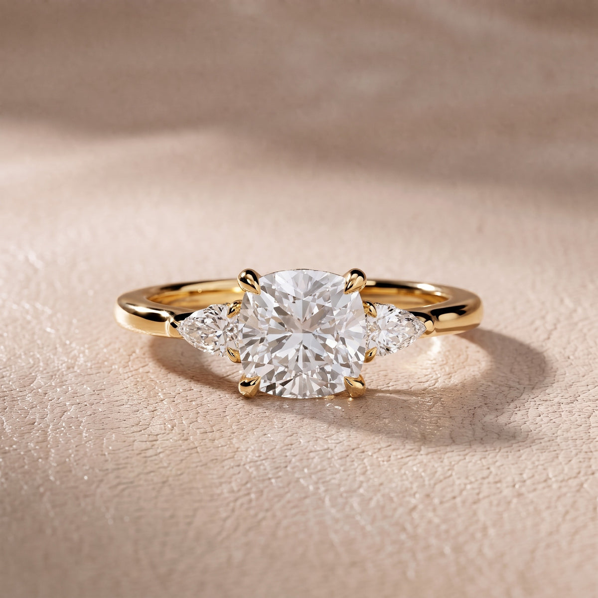 Leila Three-Stone Cushion Diamond Engagement Ring in Yellow Gold - front.jpg