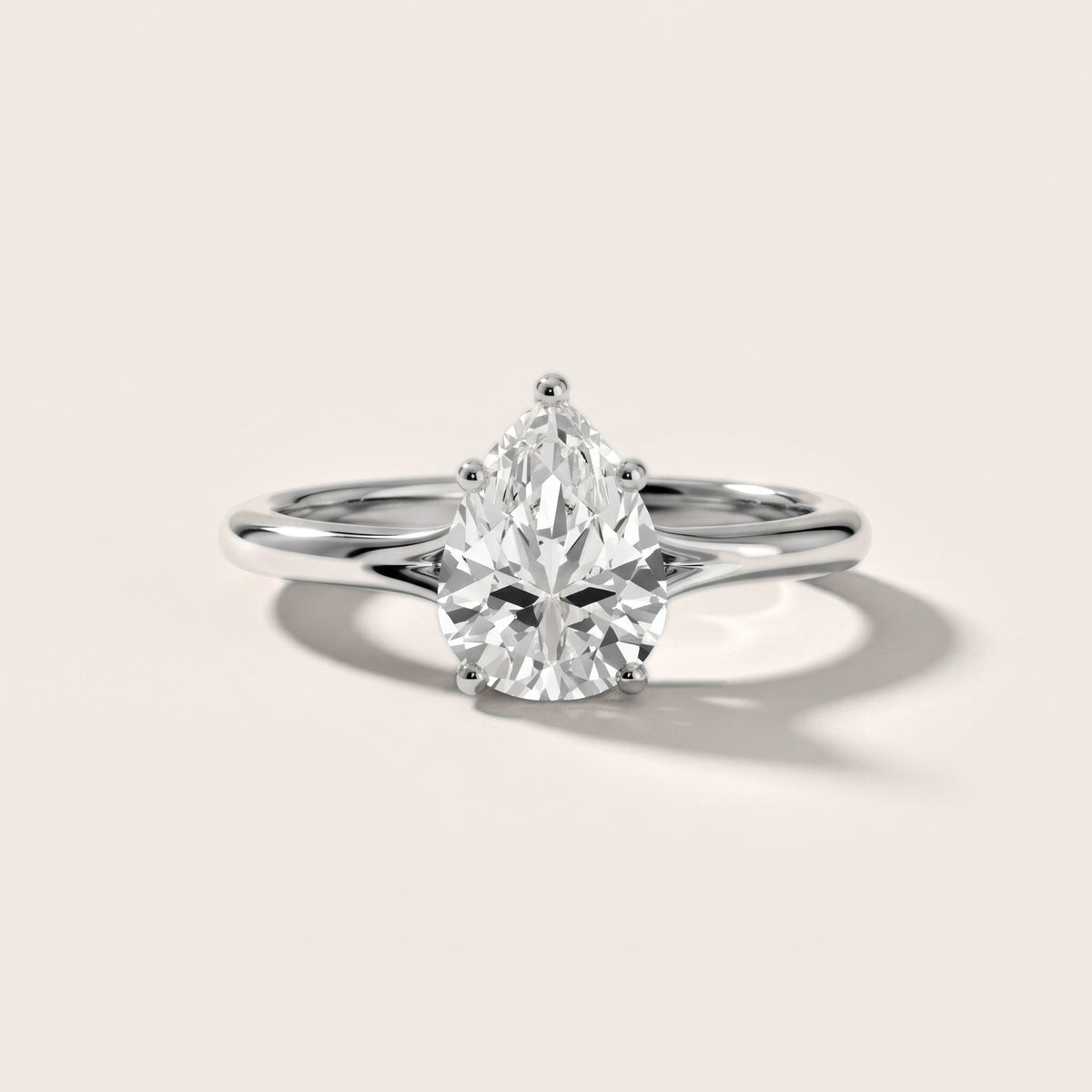 Melanie Solitaire Split Shank Pear Diamond Engagement Ring in Silver - front.jpg