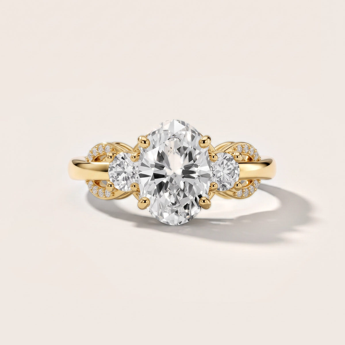 Briar Vine Three-Stone Oval Diamond Engagement Ring in Yellow Gold - front.jpg
