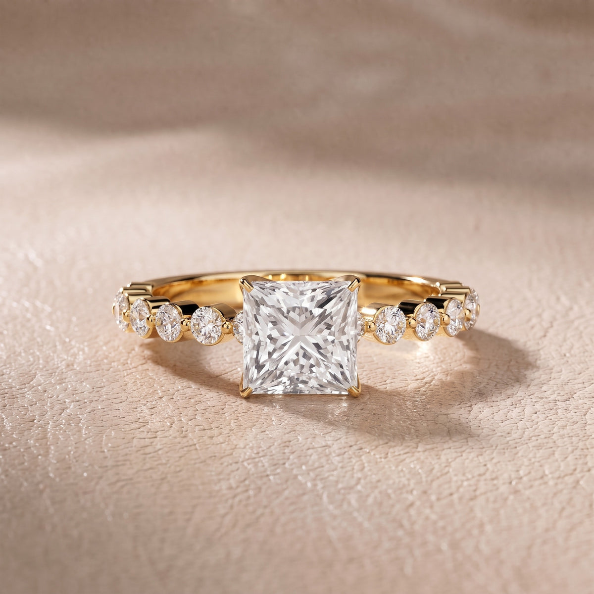 Eleanor Majesty Side Stone Princess Diamond Engagement Ring in Yellow Gold - front.jpg