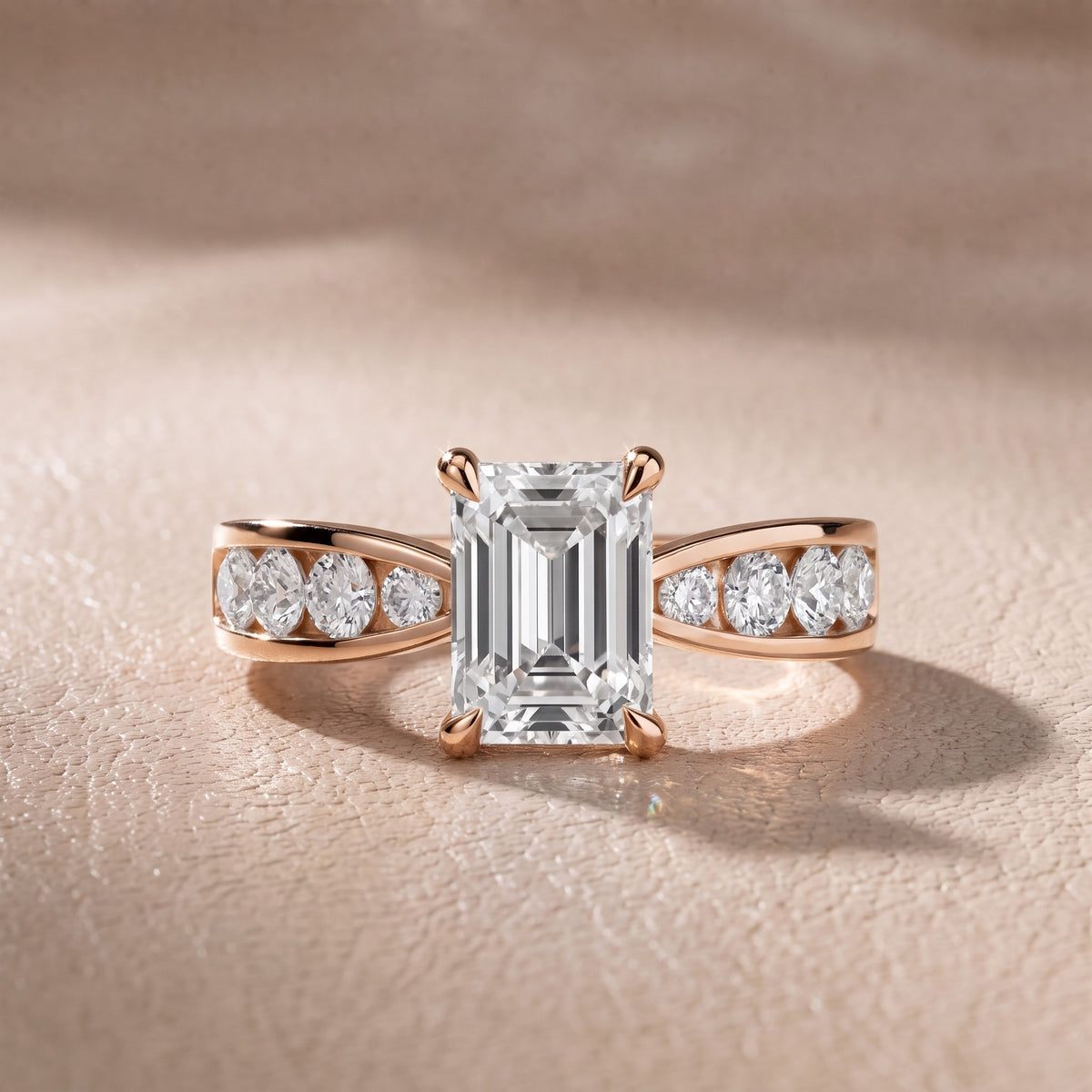 Rosalie Channel Set Sidestone Emerald Diamond Engagement Ring in Rose Gold - front.jpg