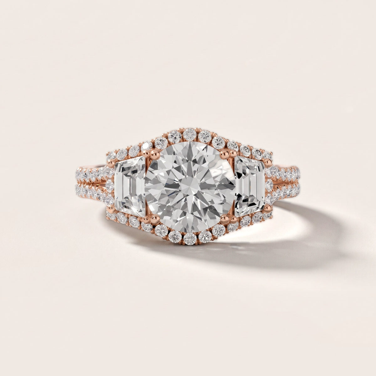 Oakley Three-Stone Split Shank Round Diamond Engagement Ring in Rose Gold - front.jpg