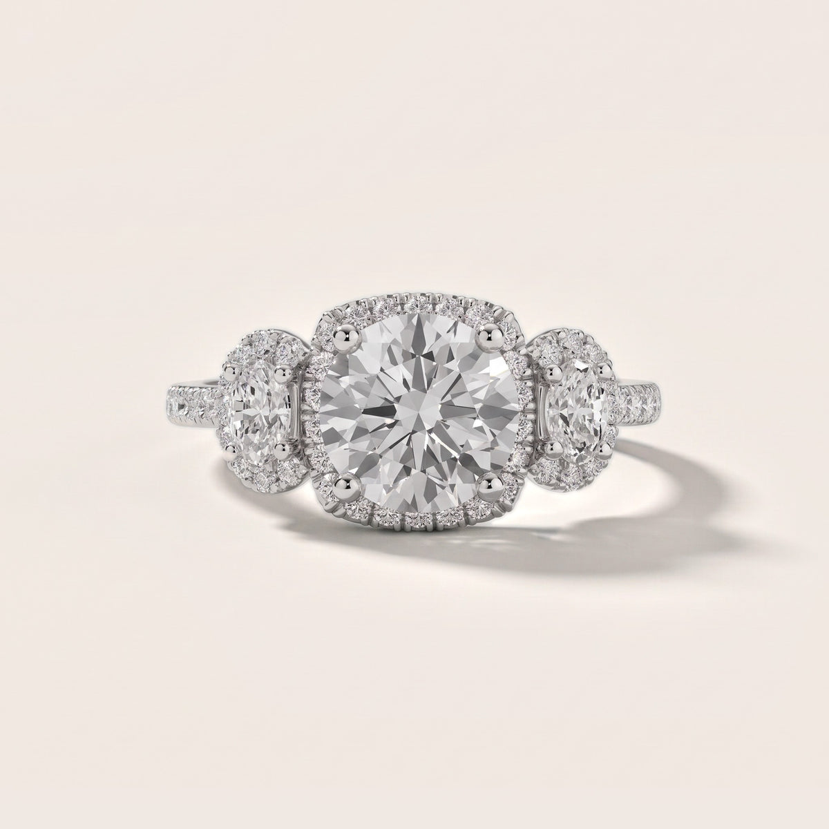 Austin Three-Stone Halo Round Diamond Engagement Ring in Platinum - front.jpg