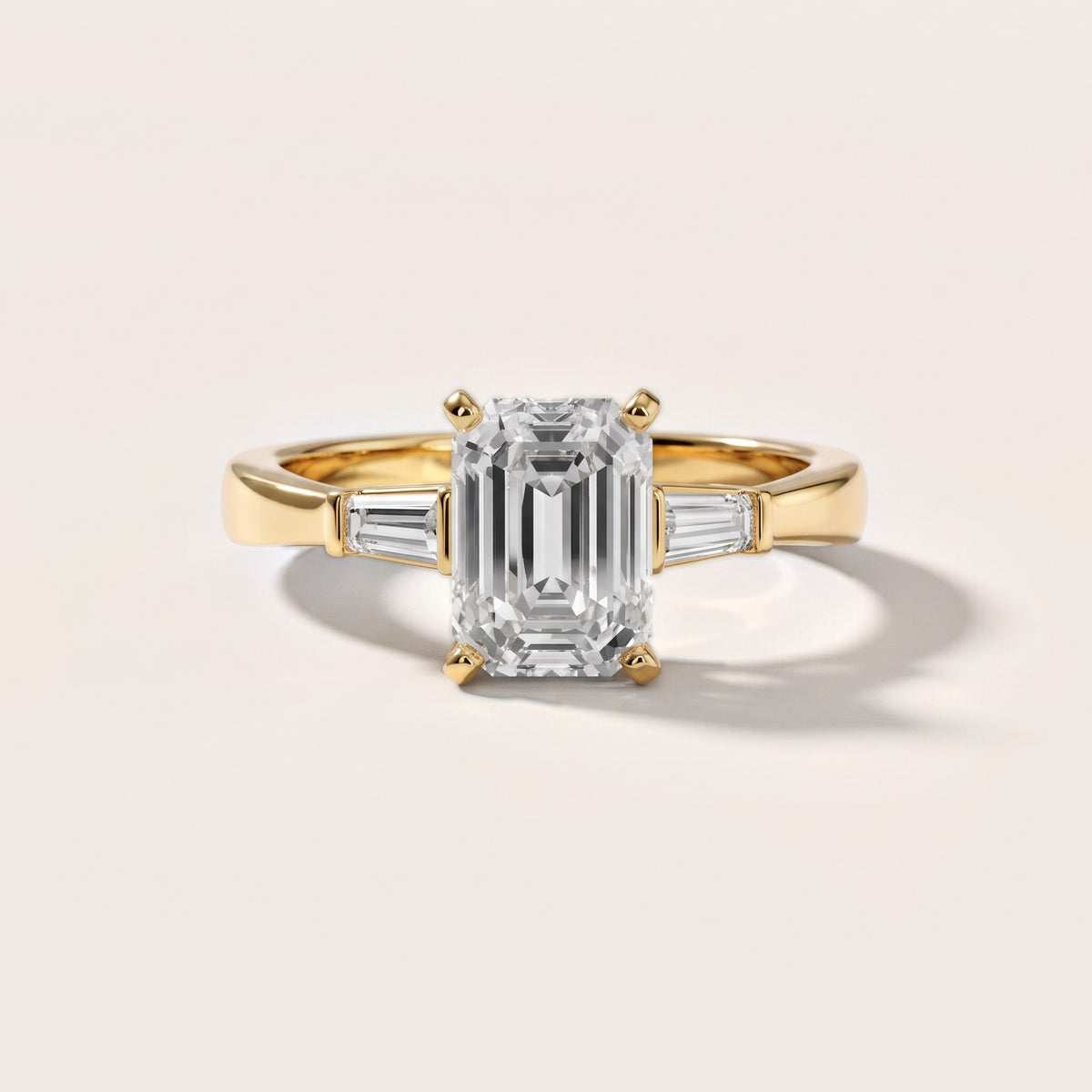 Jacinta Baguette Three-Stone Emerald Diamond Engagement Ring in Yellow Gold - front.jpg