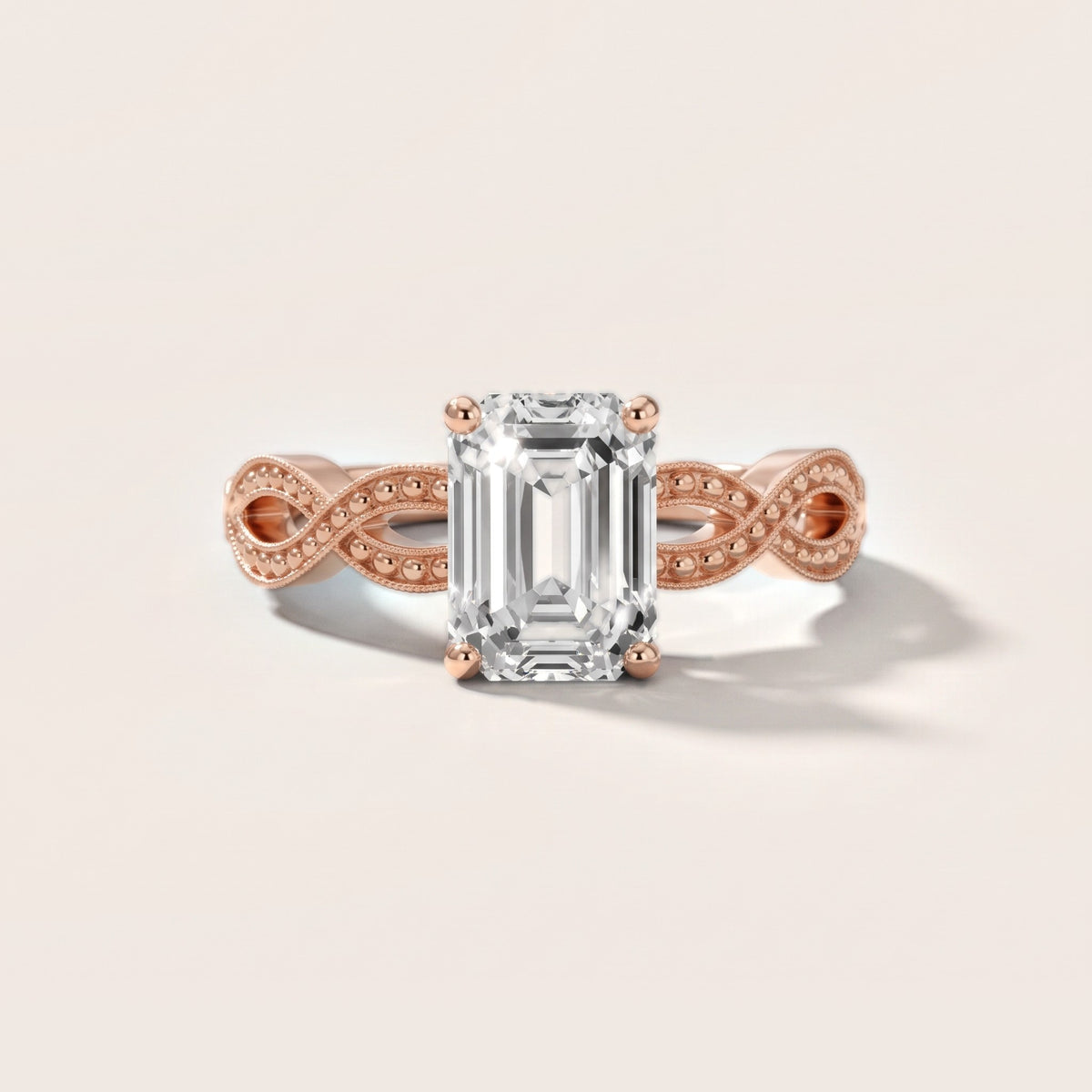 Jeanie Twist Solitaire Emerald Diamond Engagement Ring in Rose Gold - front.jpg