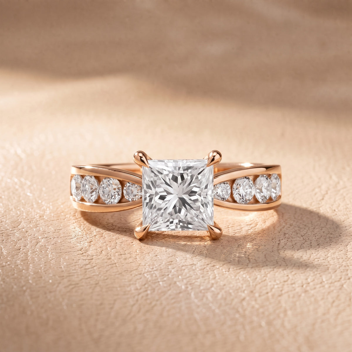 Rosalie Channel Set Sidestone Princess Diamond Engagement Ring in Rose Gold - front.jpg