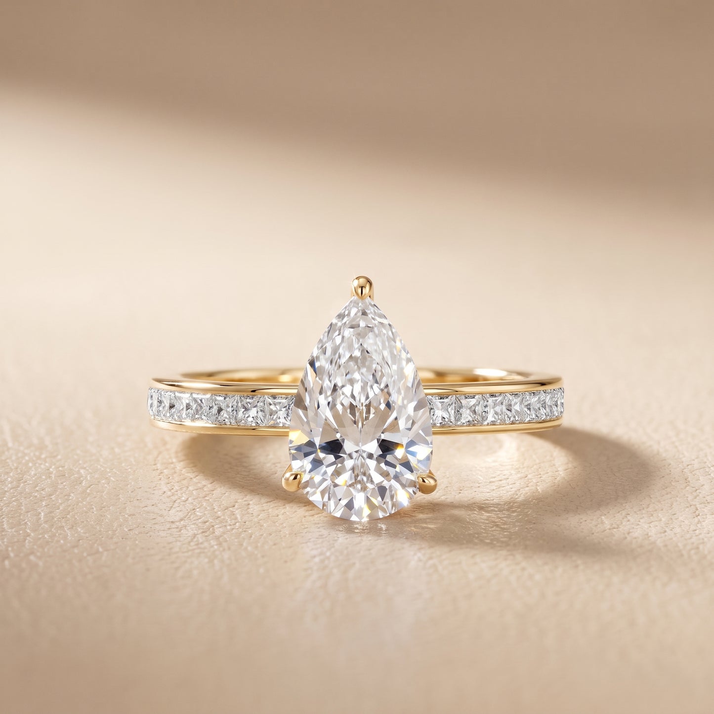 Brielle Channel Set Solitaire Pear Diamond Ring in Yellow Gold - front.jpg