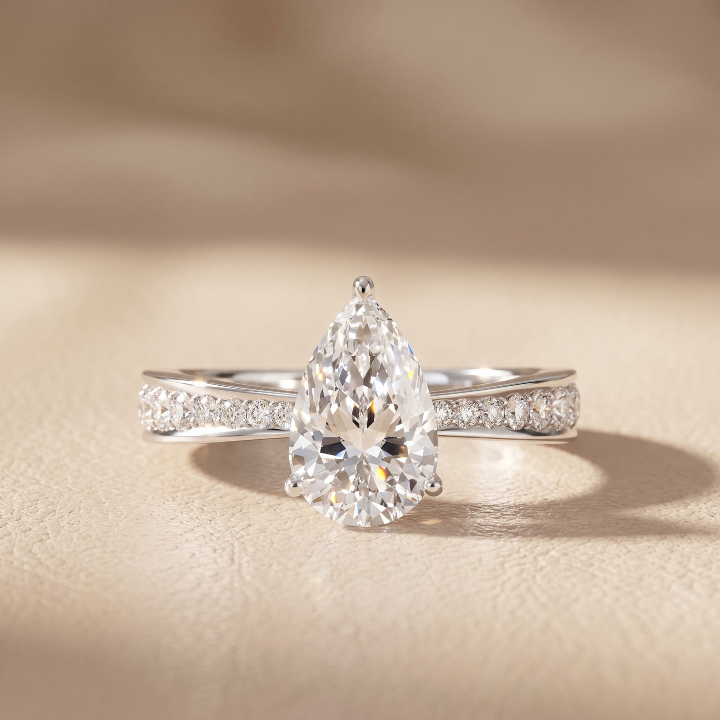 Rhea Sidestone Pavé Pear Diamond Engagement Ring in Platinum - front.jpg