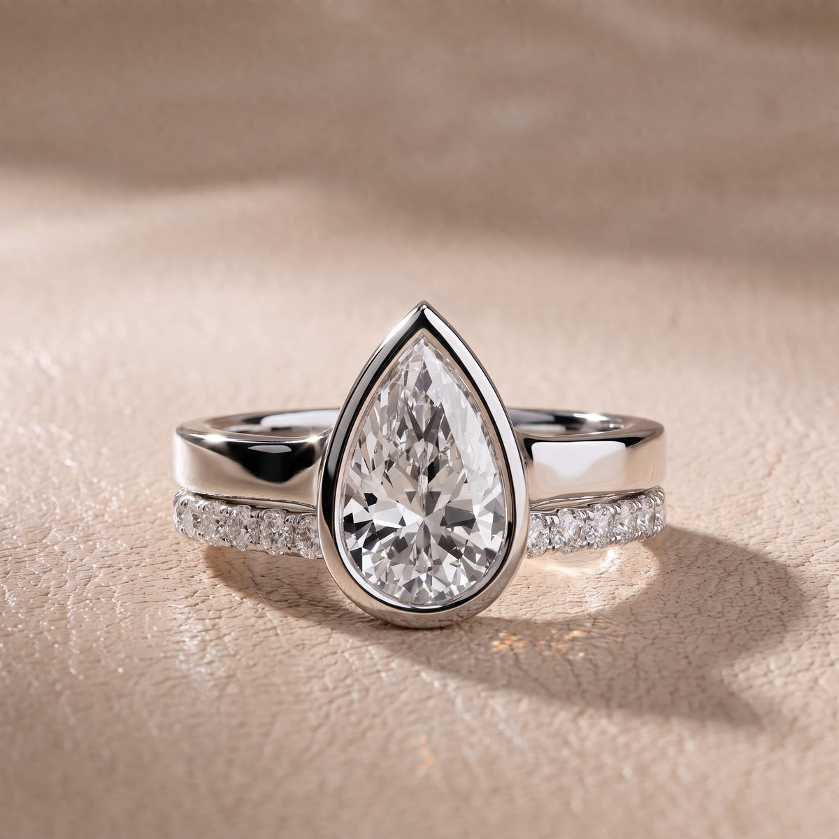 Ayla Bezel Bypass Pear Diamond Engagement Ring in Platinum - front.jpg