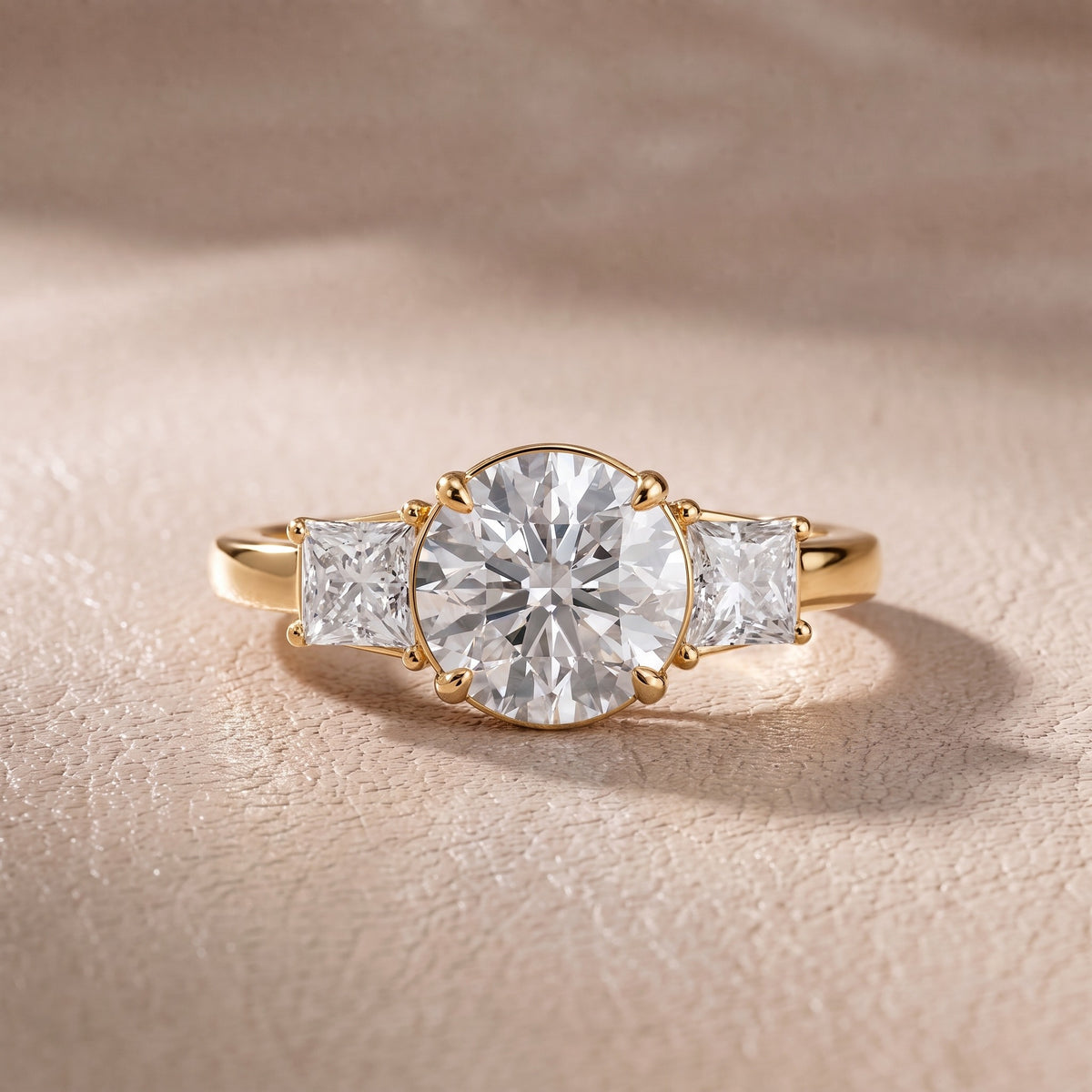 Aria Three-Stone Basket Round Diamond Engagement Ring in Yellow Gold - front.jpg