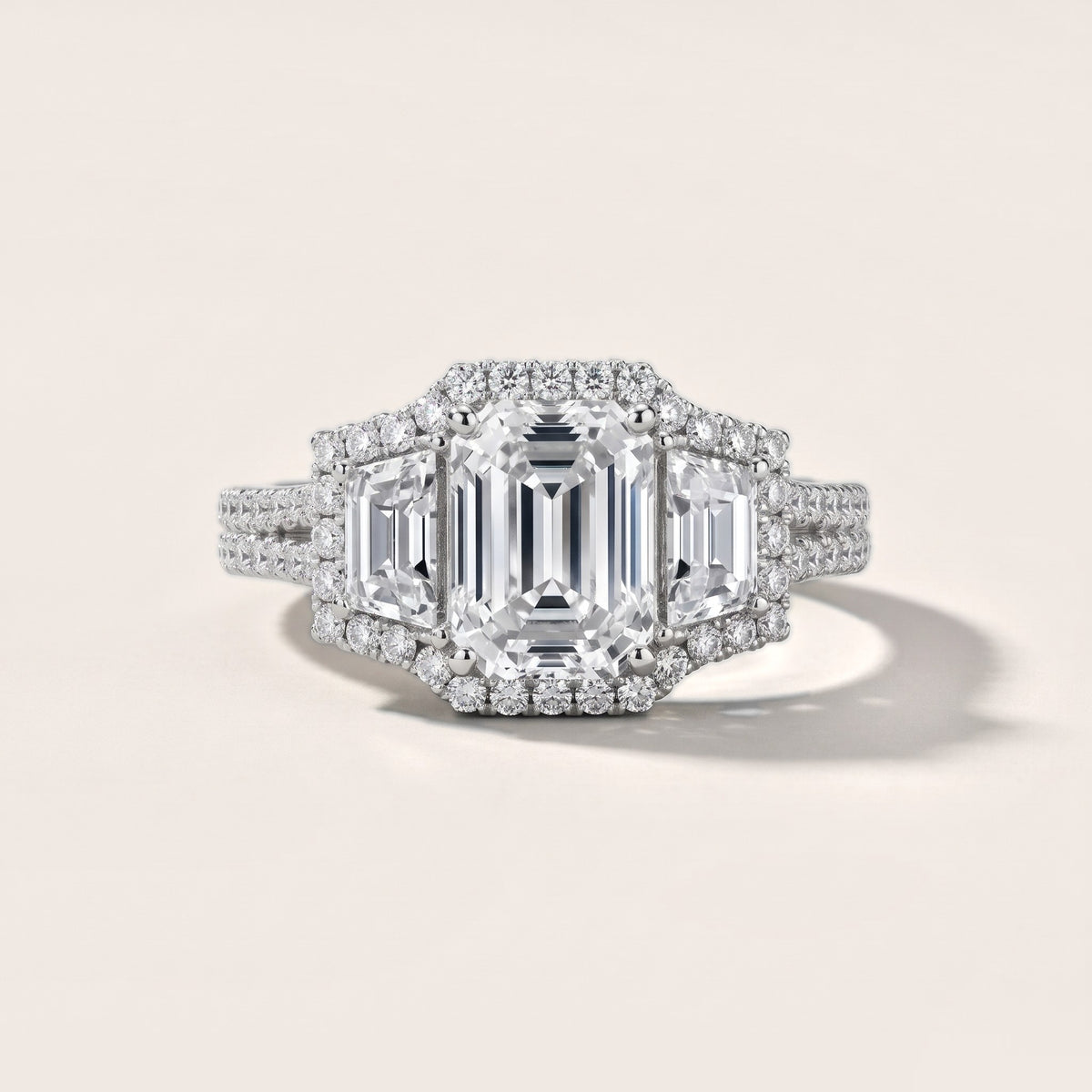 Oakley Three-Stone Split Shank Emerald Diamond Engagement Ring in Platinum - front.jpg