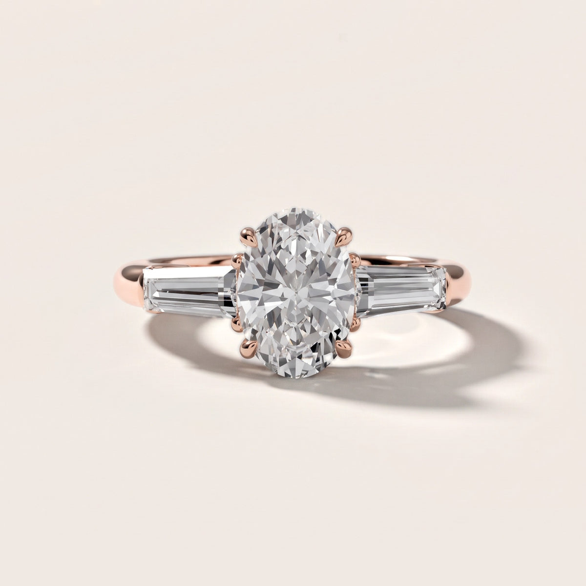 Davina Baguette Three-Stone Oval Diamond Engagement Ring in Rose Gold - front.jpg
