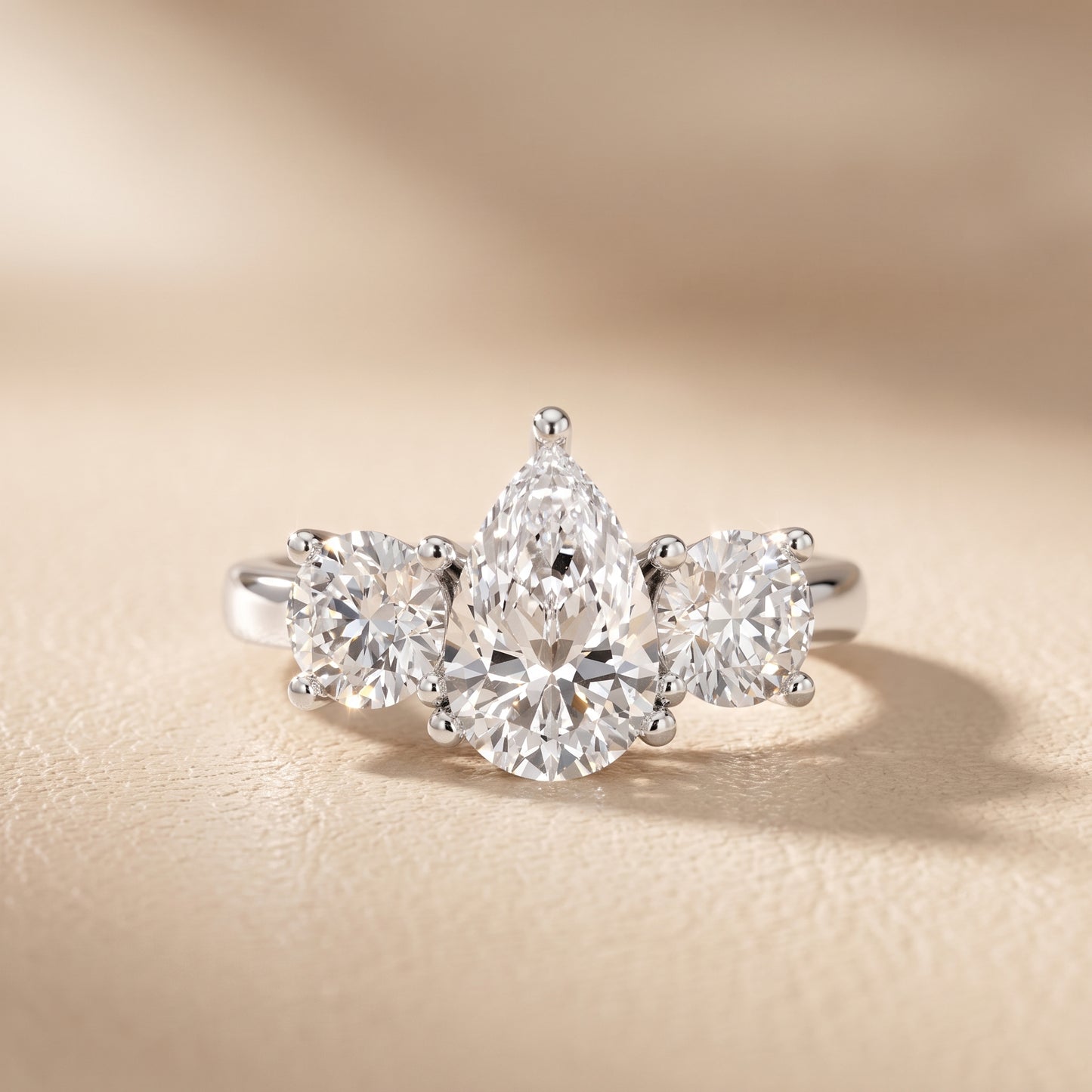 Callie Three-Stone Trellis Pear Diamond Engagement Ring in Platinum - front.jpg