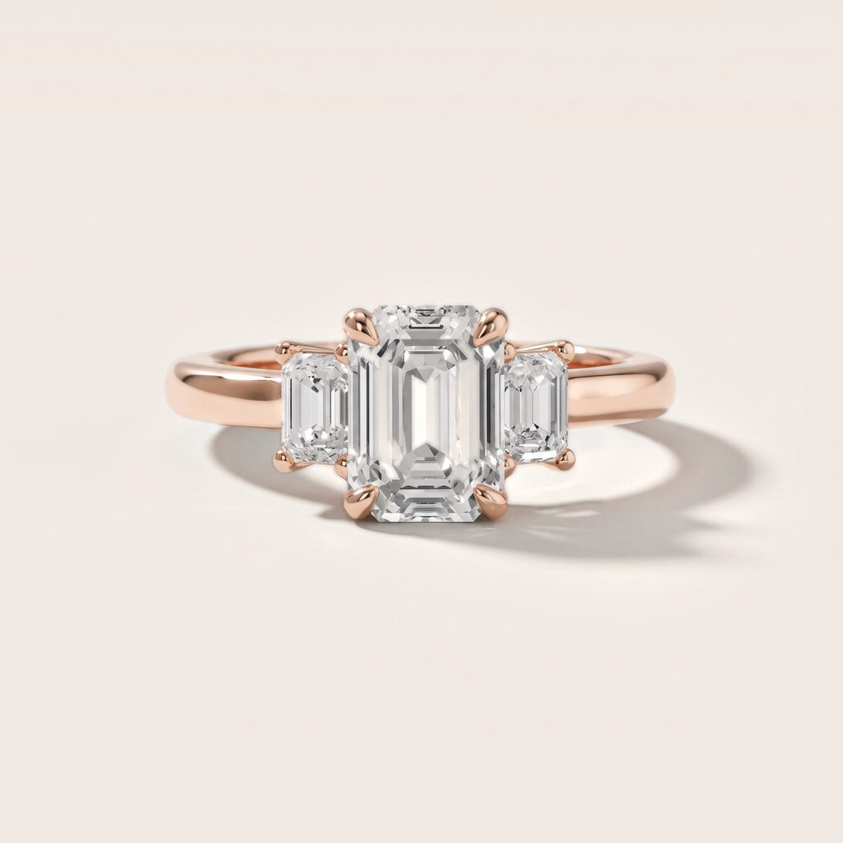 Babette Deco Three-Stone Emerald Diamond Engagement Ring in Rose Gold - front.jpg