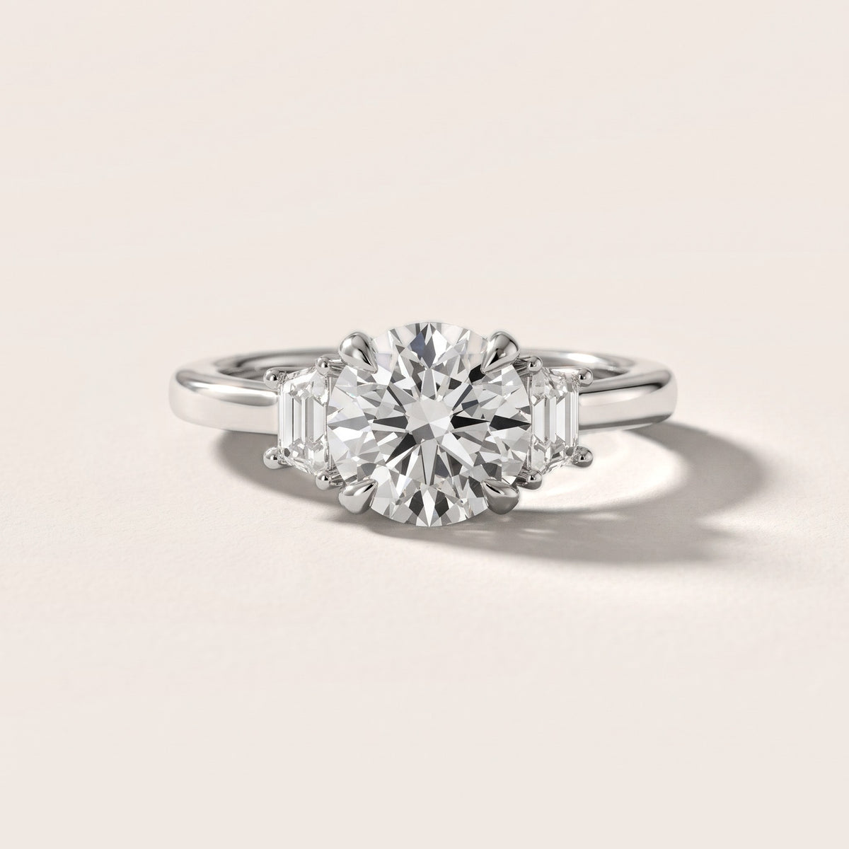 Eureka Trapezoid Three-Stone Round Diamond Engagement Ring in Platinum - front.jpg