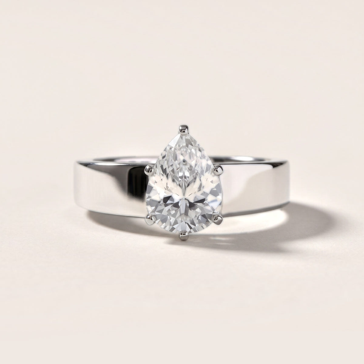 Susannah Wide Band Solitaire Pear Diamond Engagement Ring in Silver - front.jpg