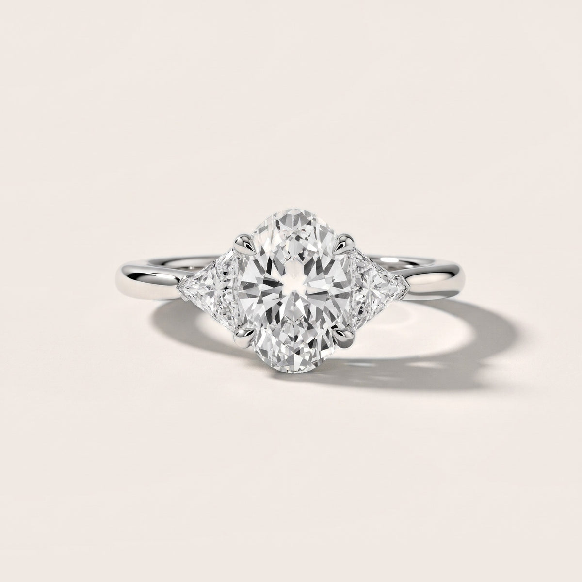 Clemency Three-Stone Cathedral Oval Diamond Engagement Ring in Silver - front.jpg