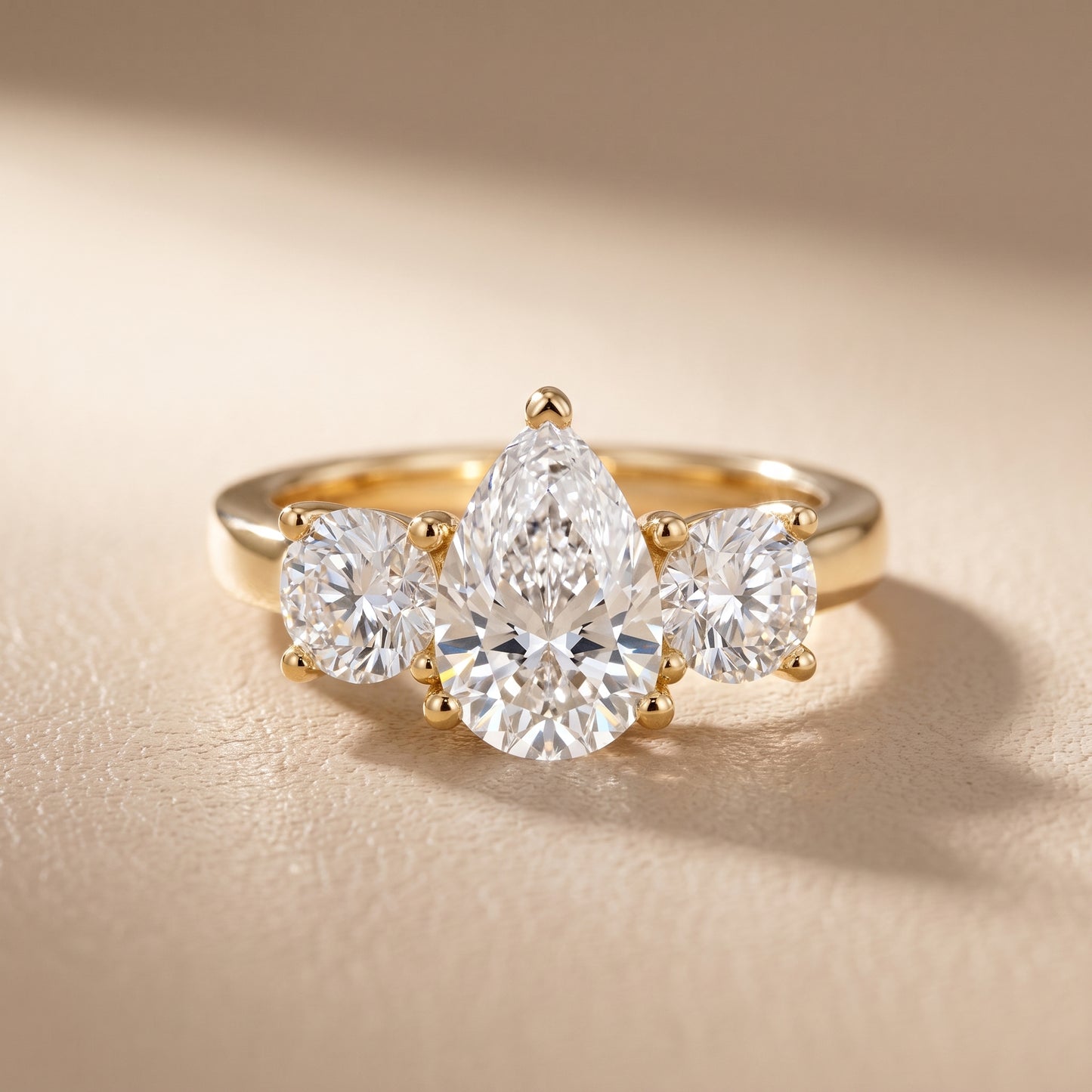 Callie Three-Stone Trellis Pear Diamond Engagement Ring in Yellow Gold - front.jpg