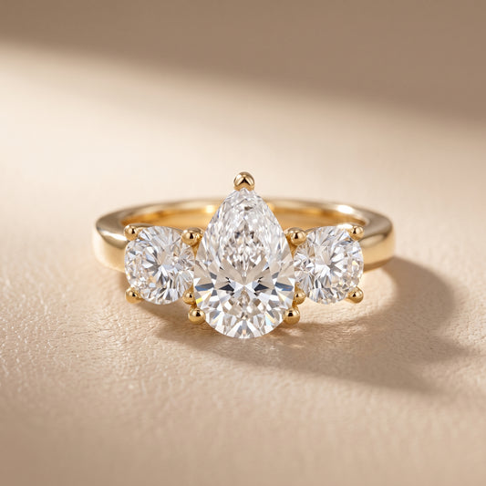Callie Three-Stone Trellis Pear Diamond Engagement Ring in Yellow Gold - front.jpg