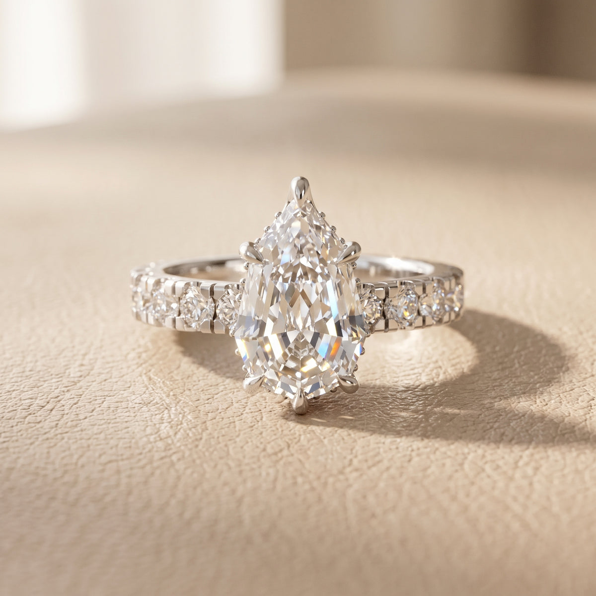 Delaney Hidden Halo French Pavé Step Cut Pear Diamond Engagement Ring in Platinum - front.jpg