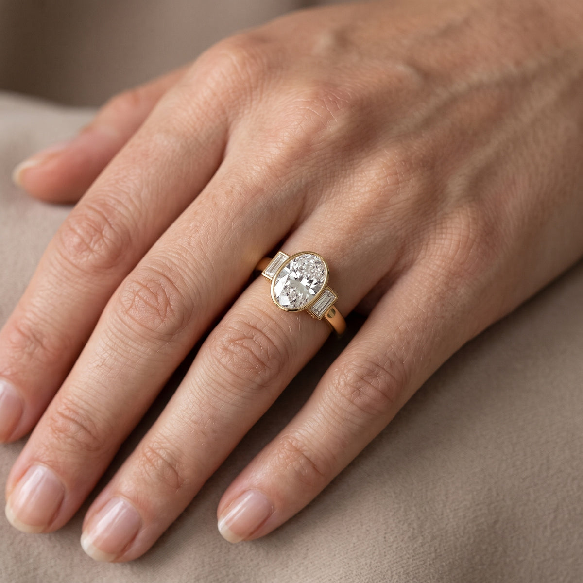 Paia Bezel Three-Stone Oval Diamond Engagement Ring in White Gold - lifestyle.jpg