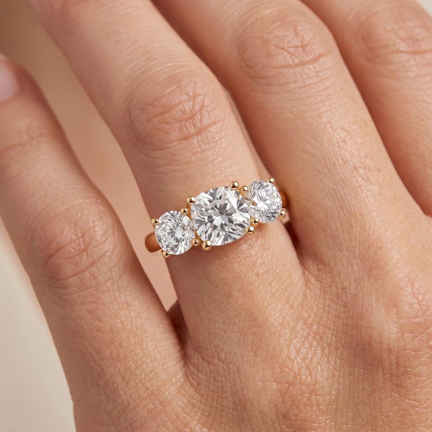 Callie Three-Stone Trellis Cushion Diamond Ring in Yellow Gold - lifestyle.jpg