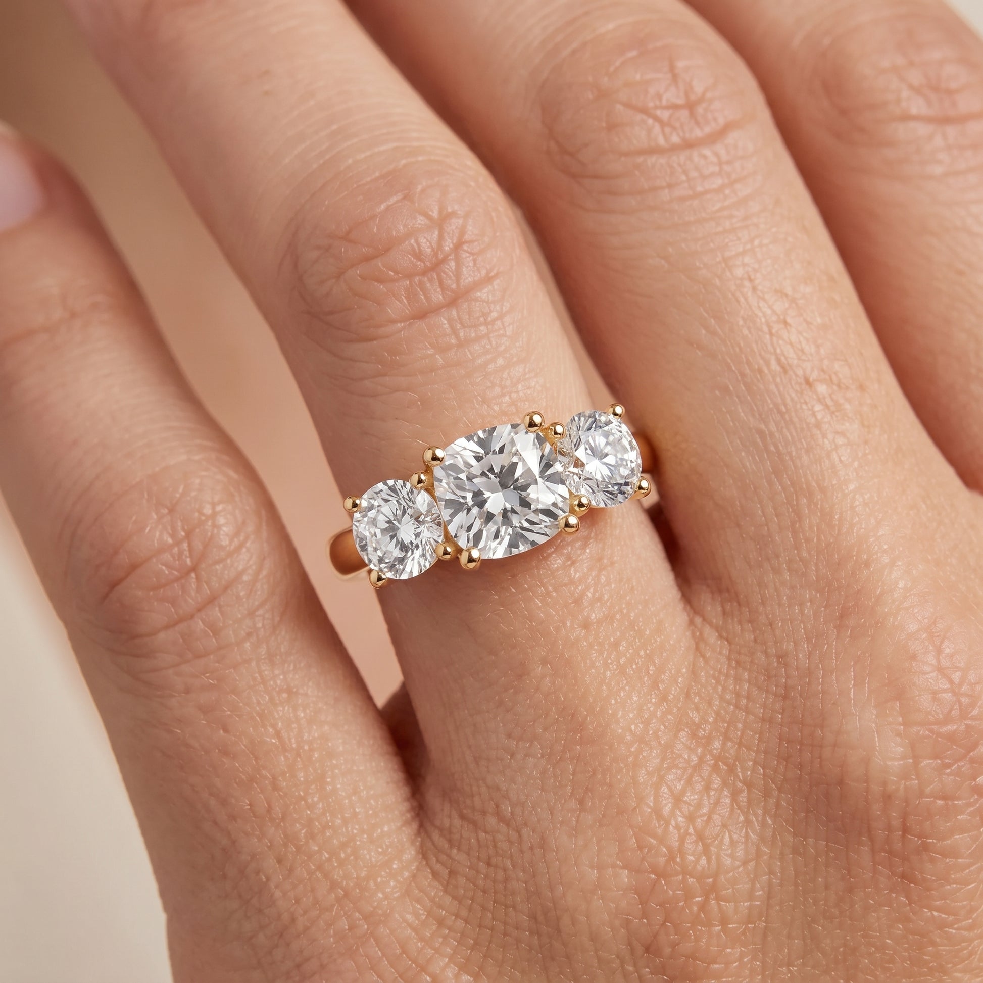 Callie Three-Stone Trellis Cushion Diamond Ring in Yellow Gold - lifestyle.jpg