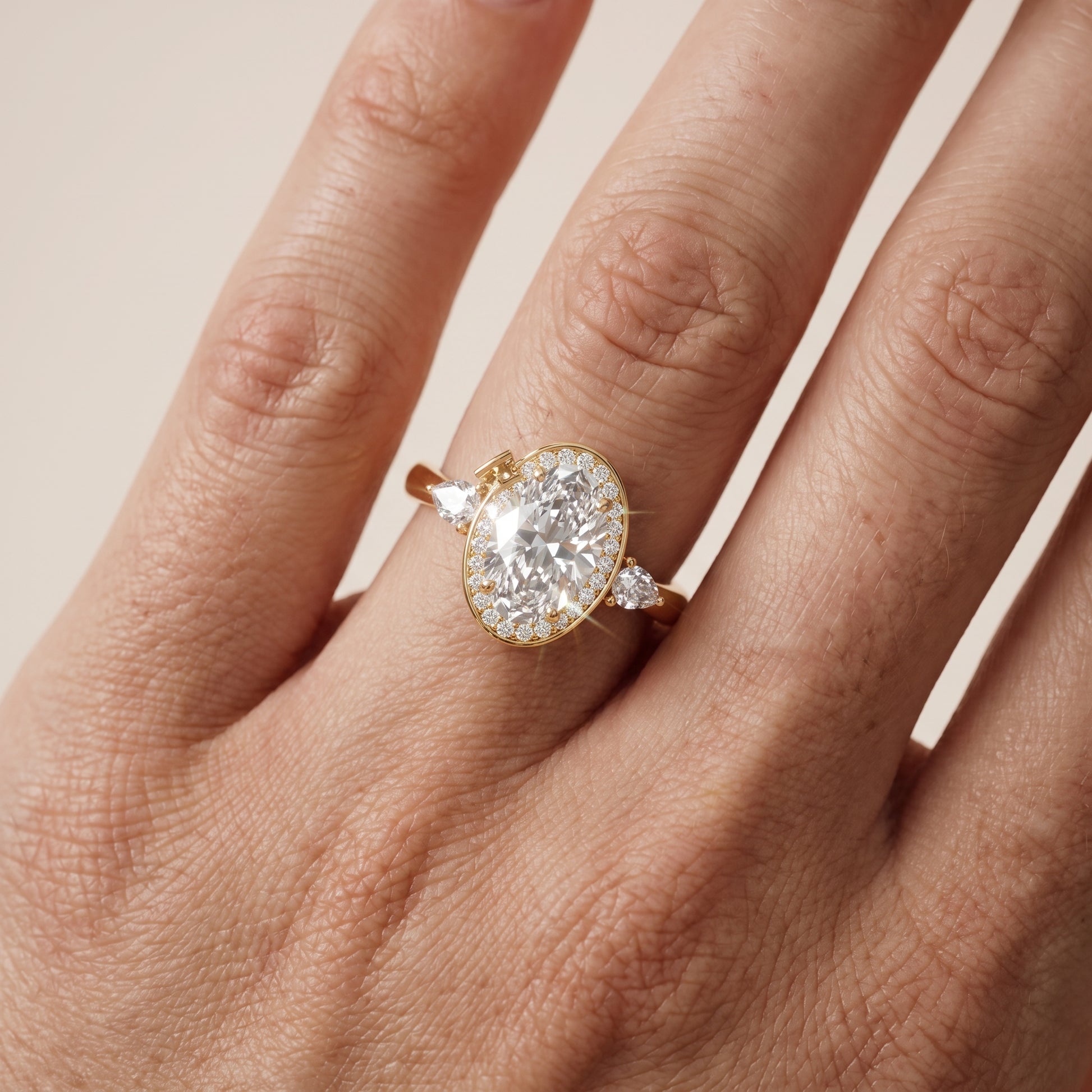 Eliza Halo Sidestone Oval Diamond Engagement Ring in Yellow Gold - lifestyle.jpg