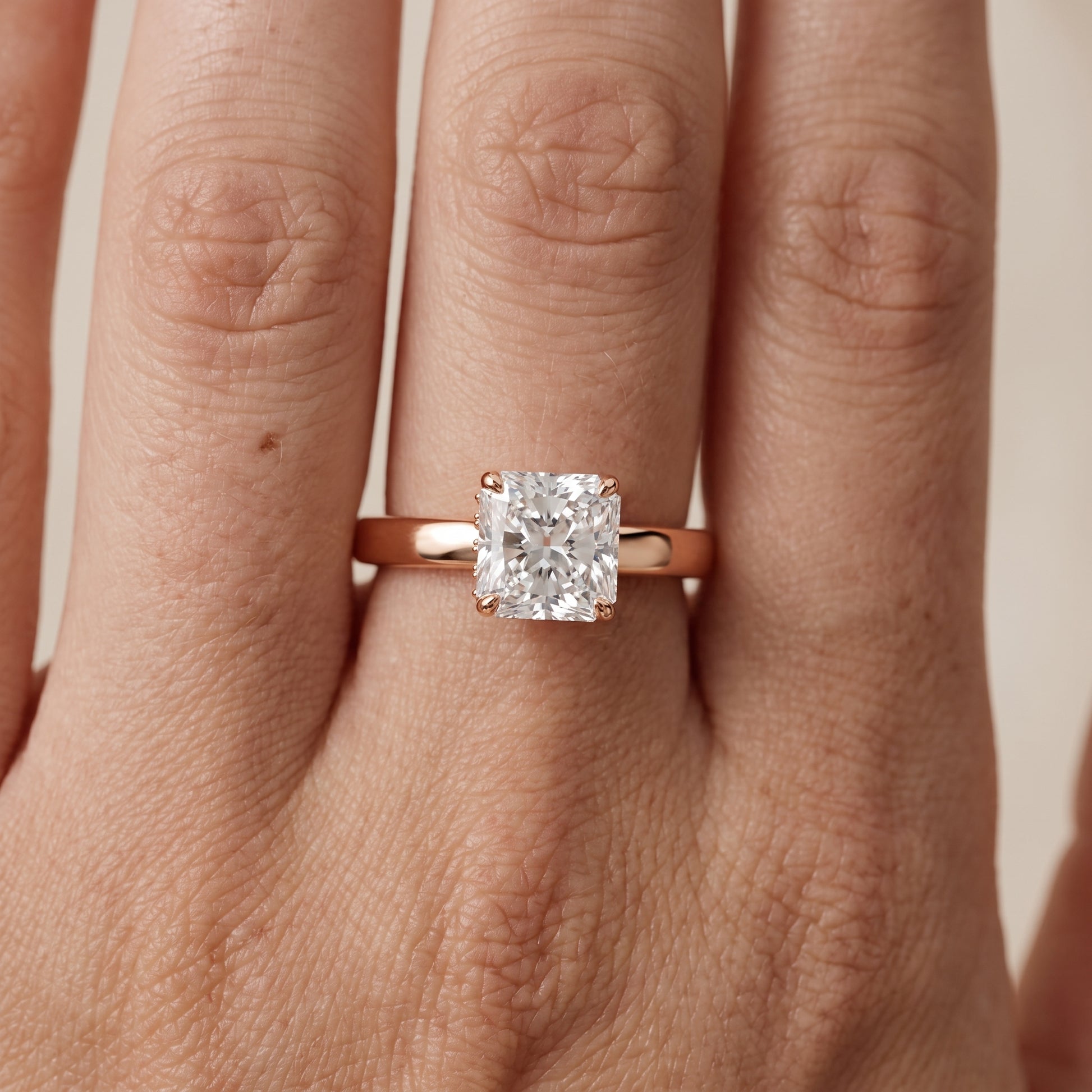 Lara Hidden Halo Radiant Diamond Engagement Ring in Rose Gold - lifestyle.jpg