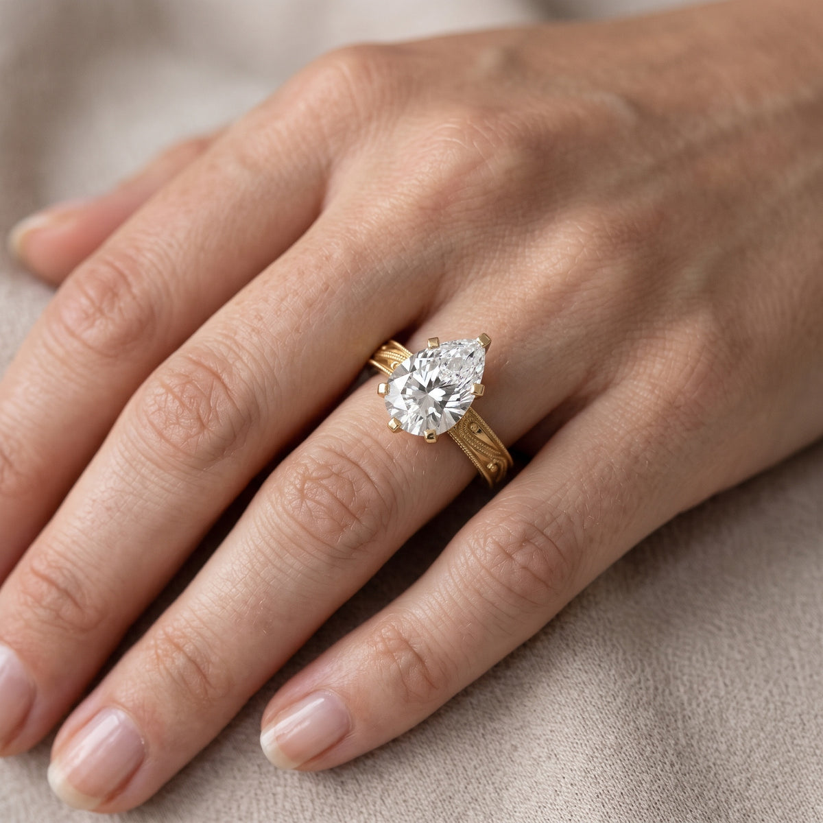 Abbie Engraved Solitaire Pear Diamond Engagement Ring in Silver - lifestyle.jpg