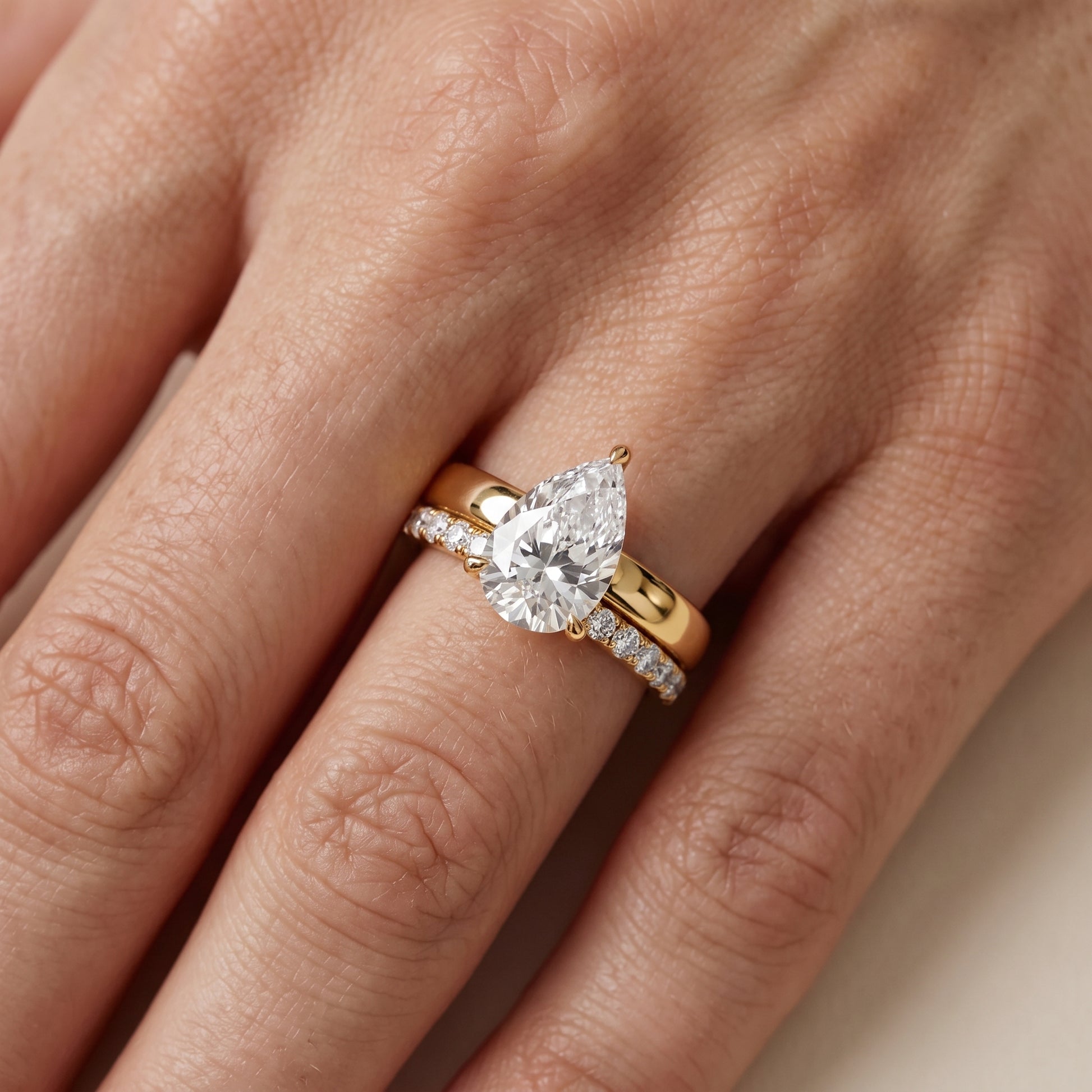 Veda Split Shank Pavé Pear Diamond Engagement Ring in Yellow Gold - lifestyle.jpg