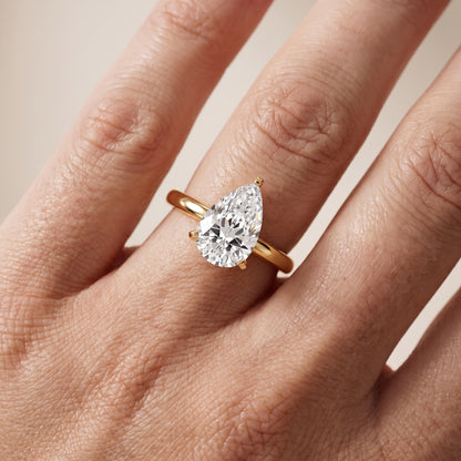 Liana Solitaire Claw Prong Pear Diamond Engagement Ring in Yellow Gold - lifestyle.jpg