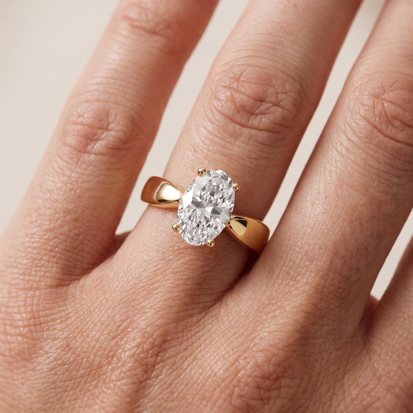 Talia Solitaire Twist Oval Diamond Engagement Ring in Yellow Gold - lifestyle.jpg