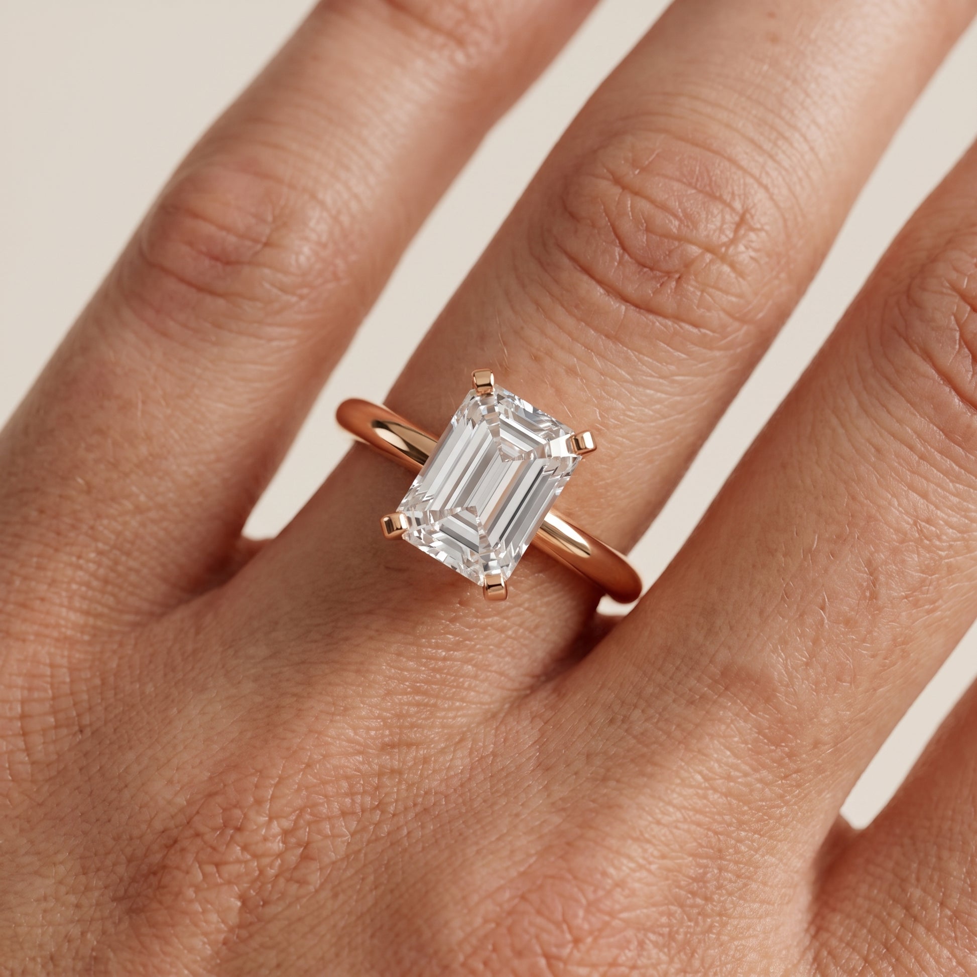Amira Six-Prong Solitaire Emerald Diamond Engagement Ring in Rose Gold - lifestyle.jpg