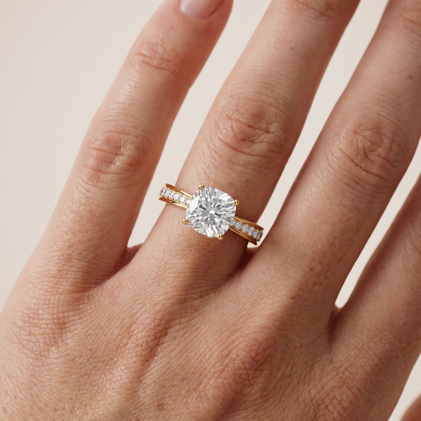 Rhea Sidestone Pavé Cushion Diamond Engagement Ring in Yellow Gold - lifestyle.jpg