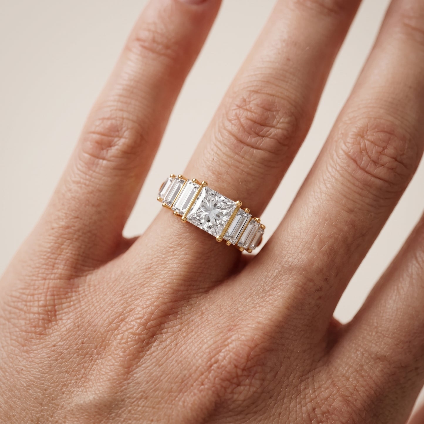 Mara Sidestone Baguette Accent Princess Diamond Engagement Ring in Yellow Gold - lifestyle.jpg