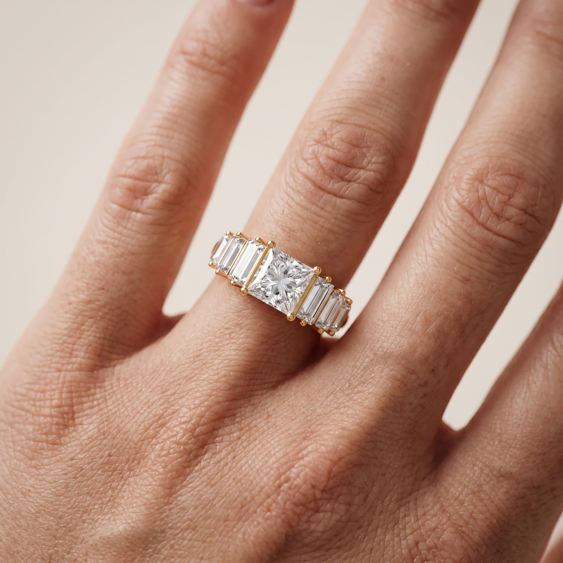 Mara Sidestone Baguette Accent Princess Diamond Engagement Ring in Yellow Gold - lifestyle.jpg
