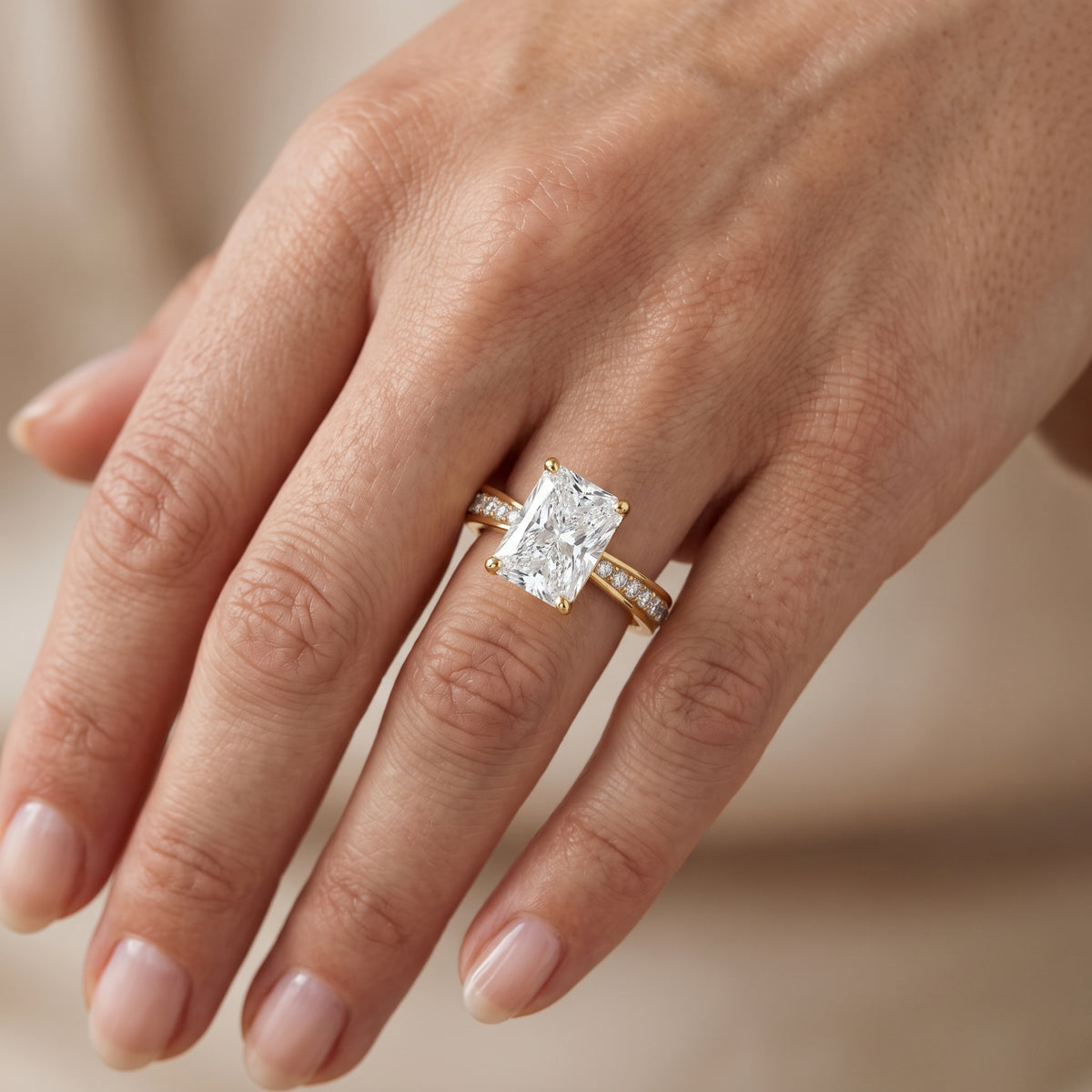 Rhea Sidestone Pavé Radiant Diamond Engagement Ring in Yellow Gold - lifestyle.jpg