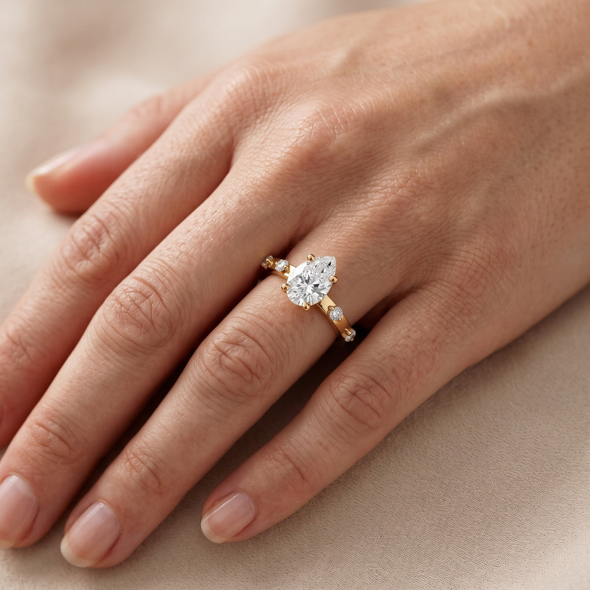 Elena Radiance Solitaire Pear Diamond Engagement Ring in Yellow Gold - lifestyle.jpg