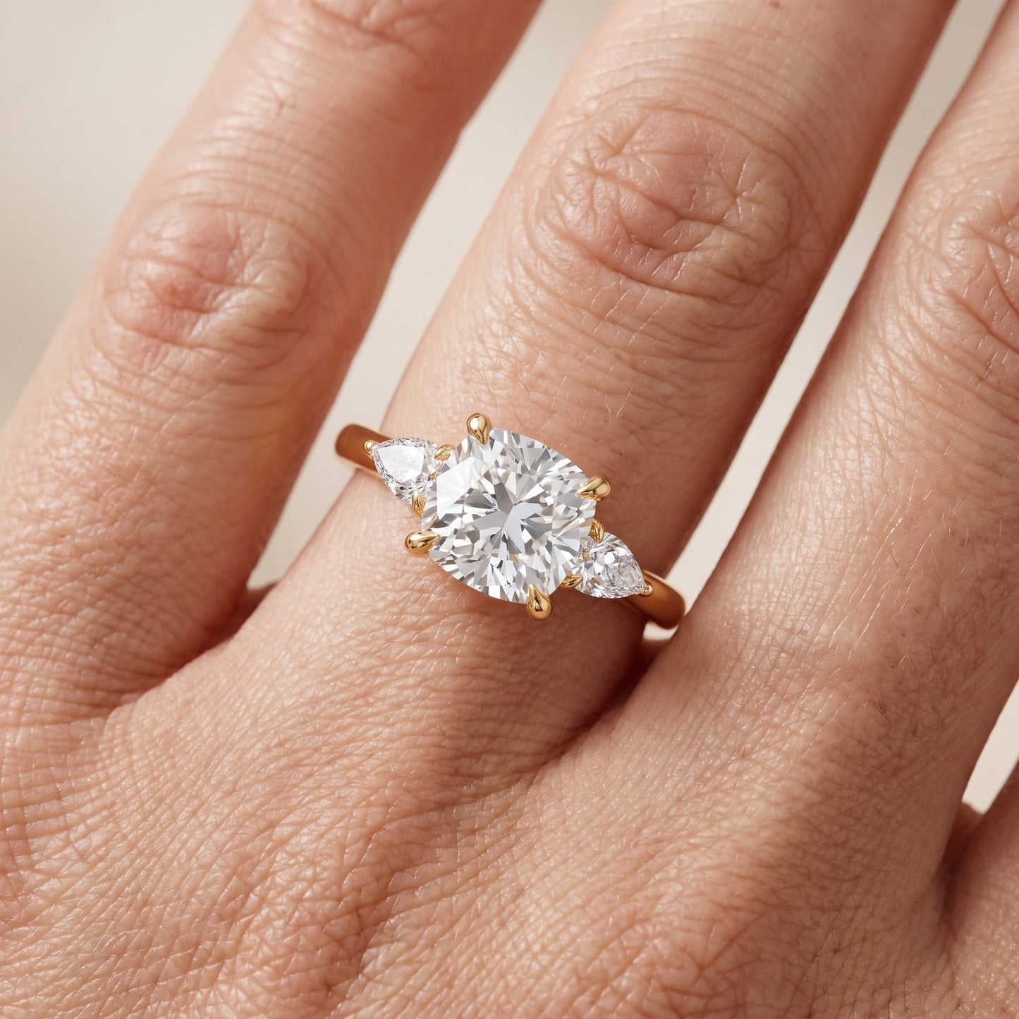 Leila Three-Stone Cushion Diamond Engagement Ring in Yellow Gold - lifestyle.jpg