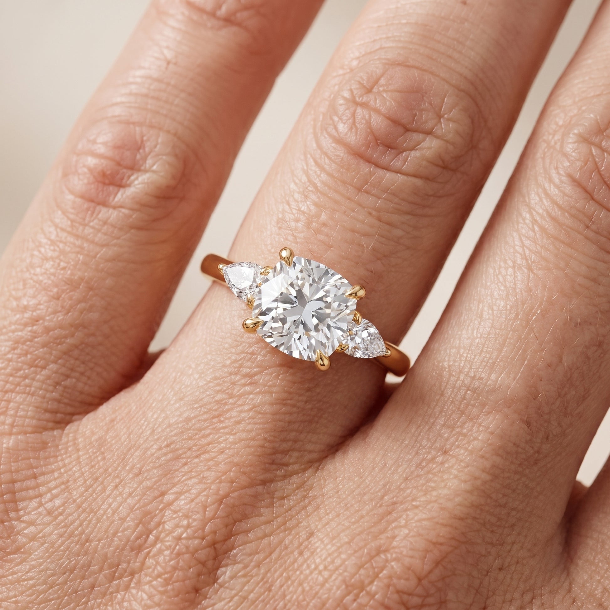 Leila Three-Stone Cushion Diamond Engagement Ring in Yellow Gold - lifestyle.jpg