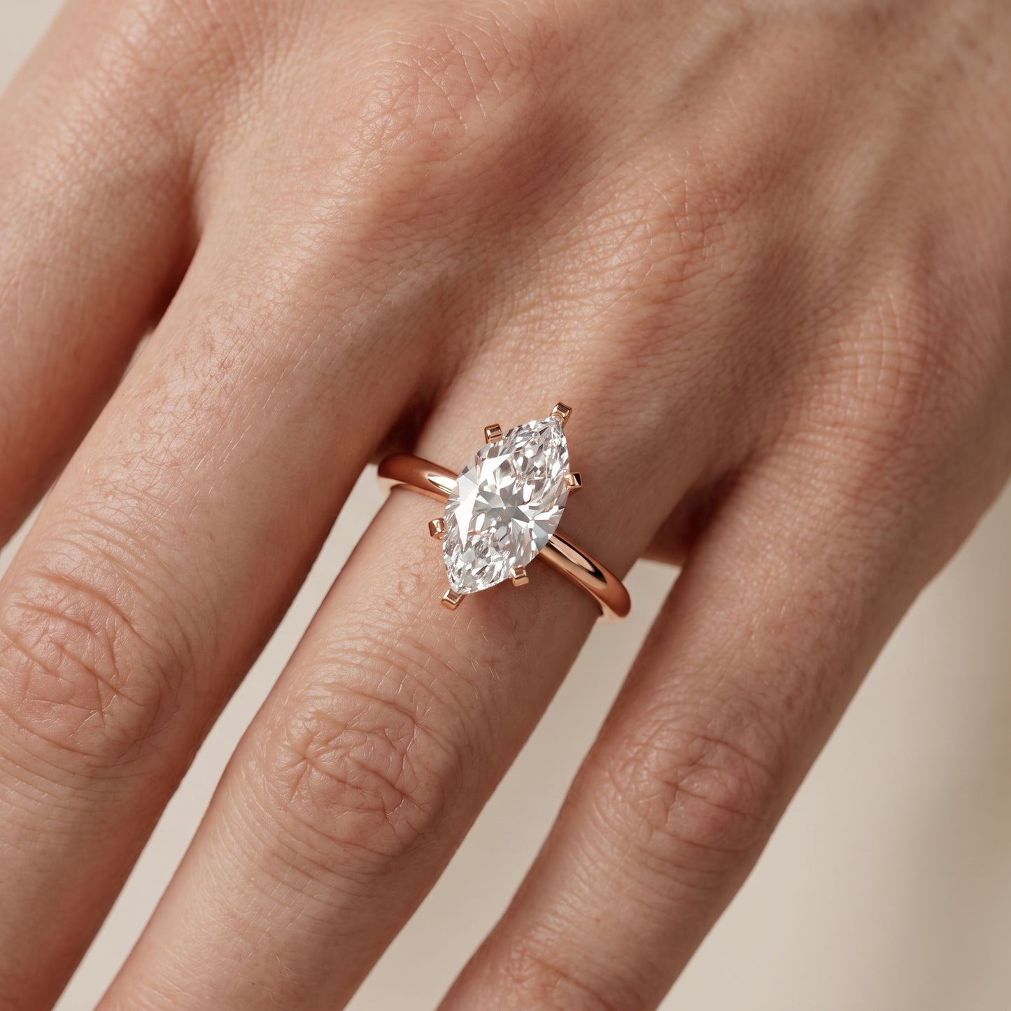 Amira Six-Prong Solitaire Marquise Diamond Engagement Ring in Rose Gold - lifestyle.jpg
