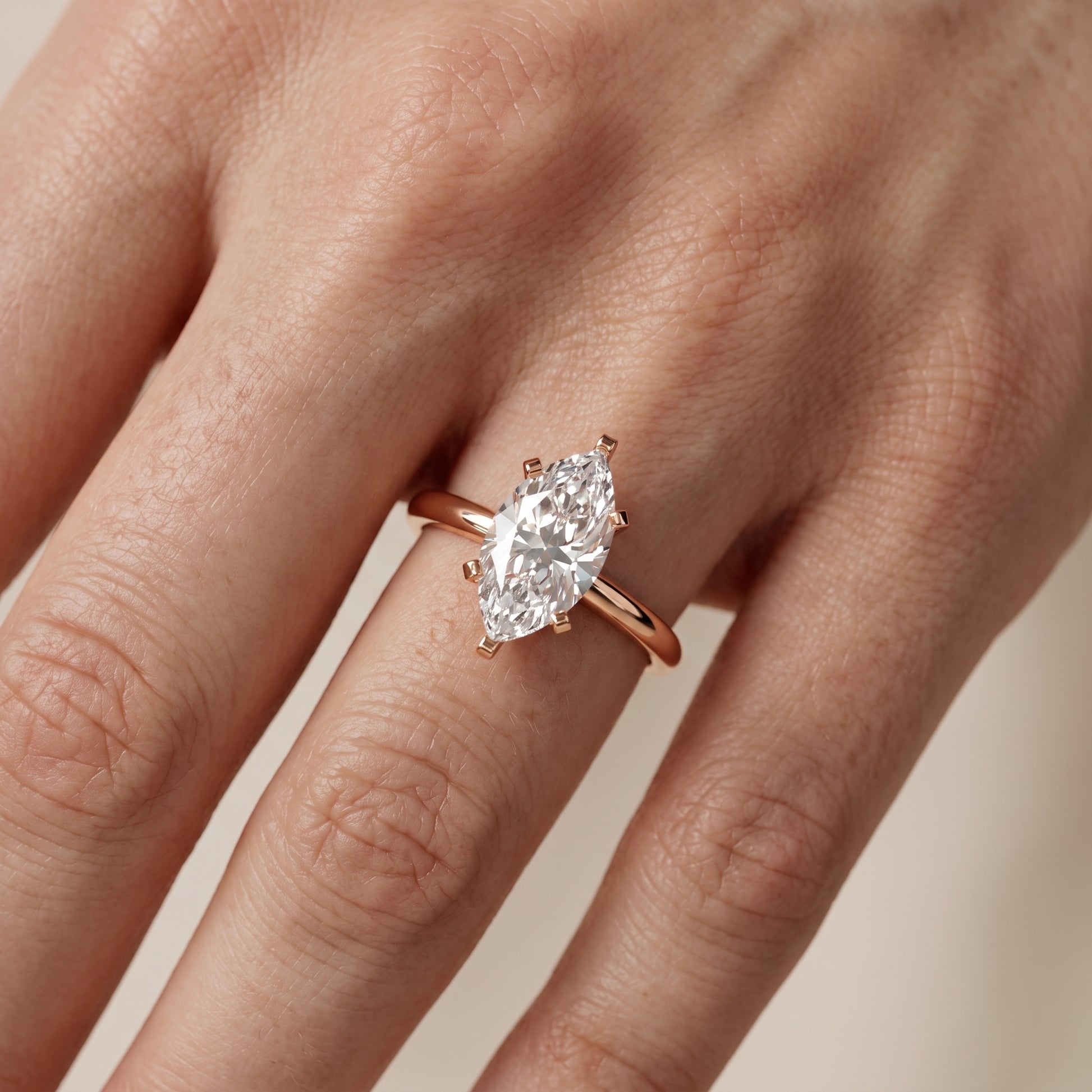 Amira Six-Prong Solitaire Marquise Diamond Engagement Ring in Rose Gold - lifestyle.jpg