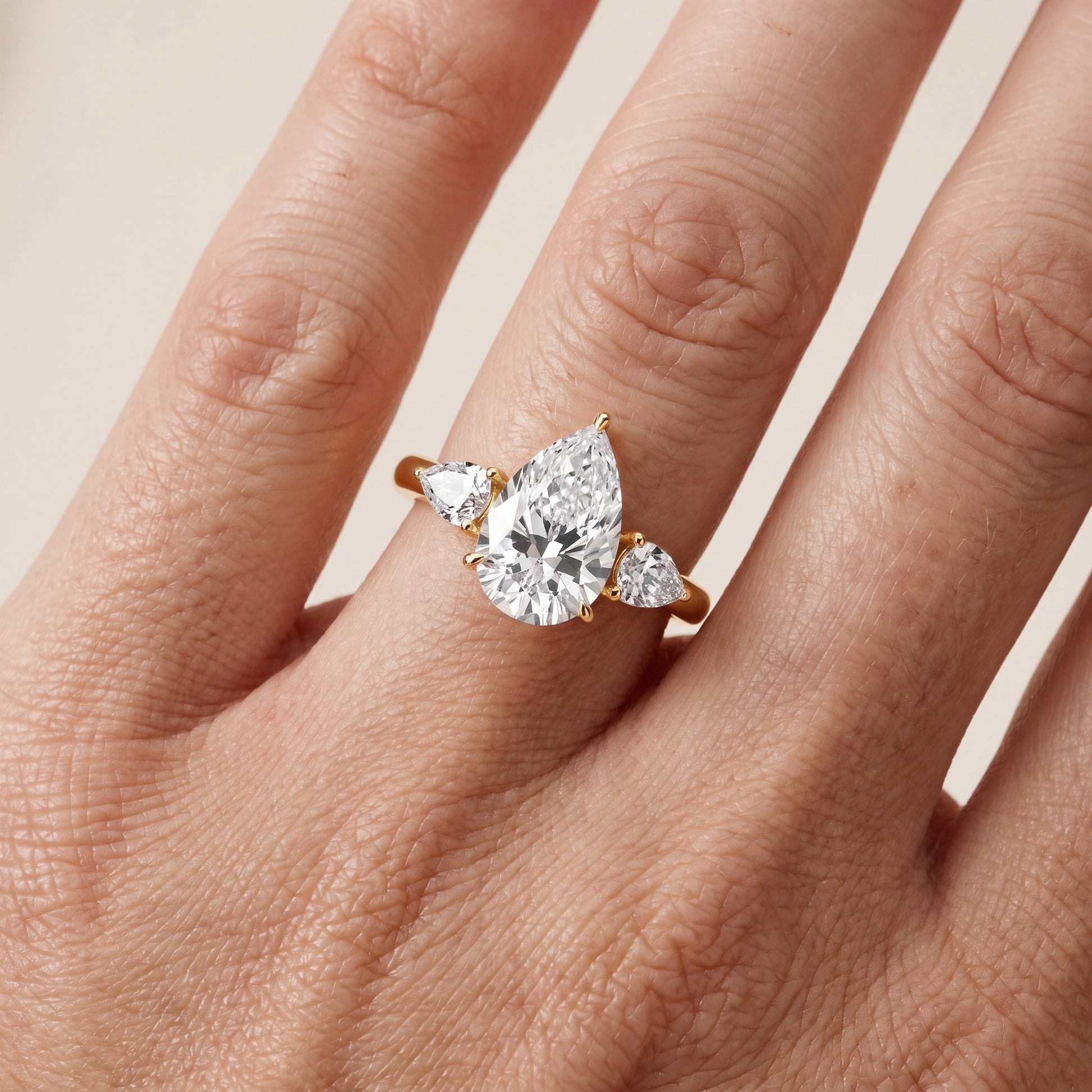 Phoebe Three-Stone Pear Diamond Ring in Yellow Gold - lifestyle.jpg
