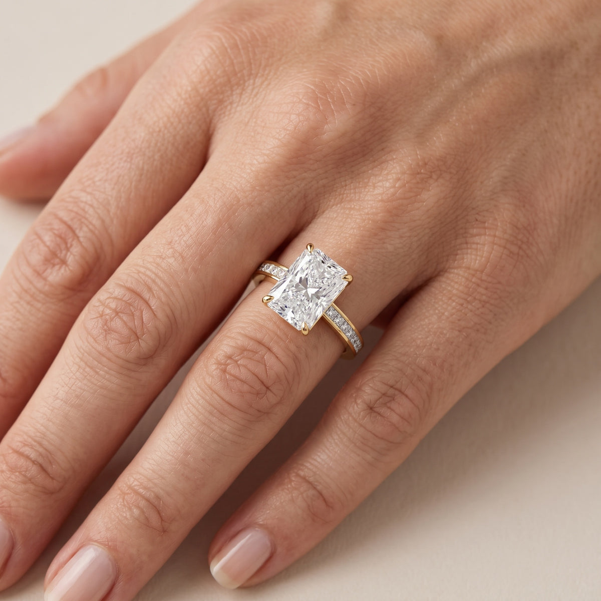 Freja Channel Set Radiant Diamond Engagement Ring in Yellow Gold - lifestyle.jpg