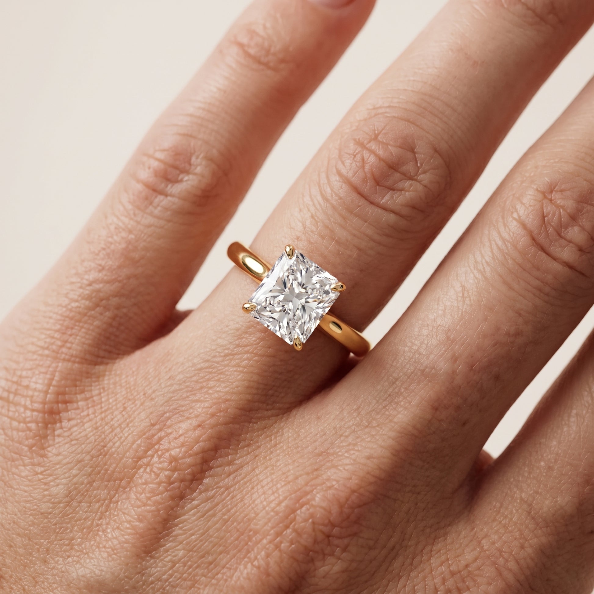 Kalia Knife Edge Solitaire Radiant Diamond Engagement Ring in Yellow Gold - lifestyle.jpg