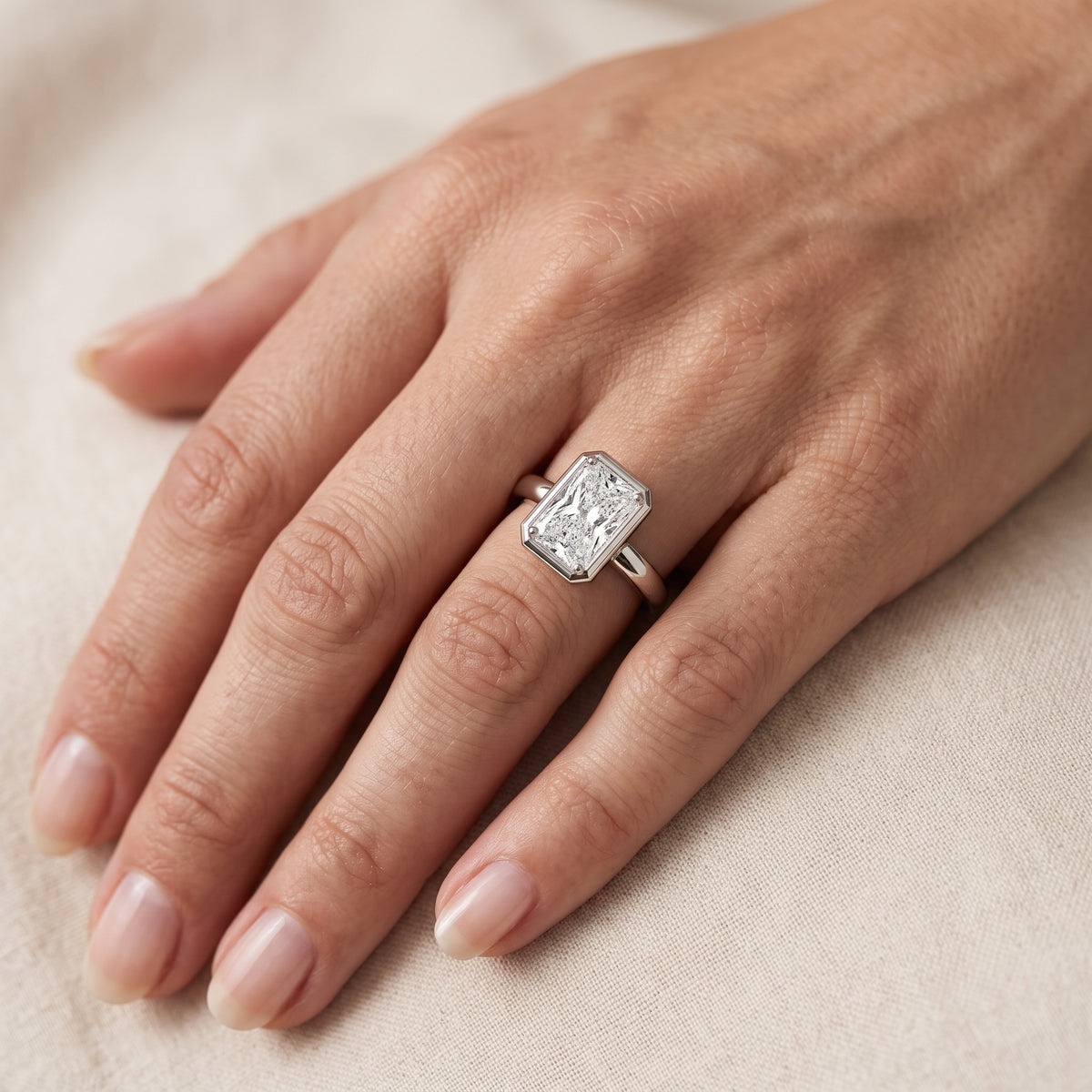Alina Bezel Solitaire Radiant Diamond Engagement Ring in White Gold - lifestyle.jpg